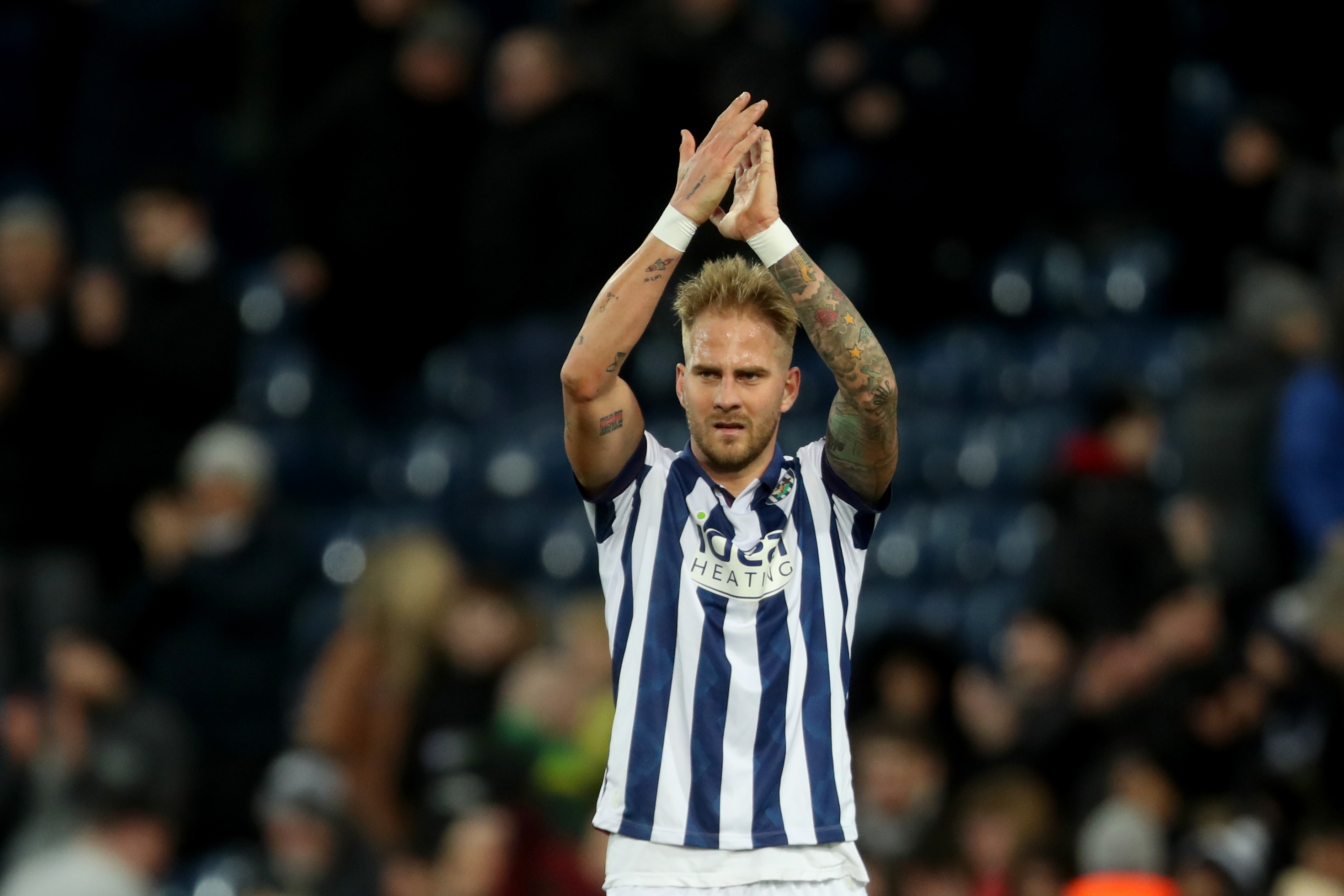 Uroś Račić applauding Albion fans after beating Portsmouth