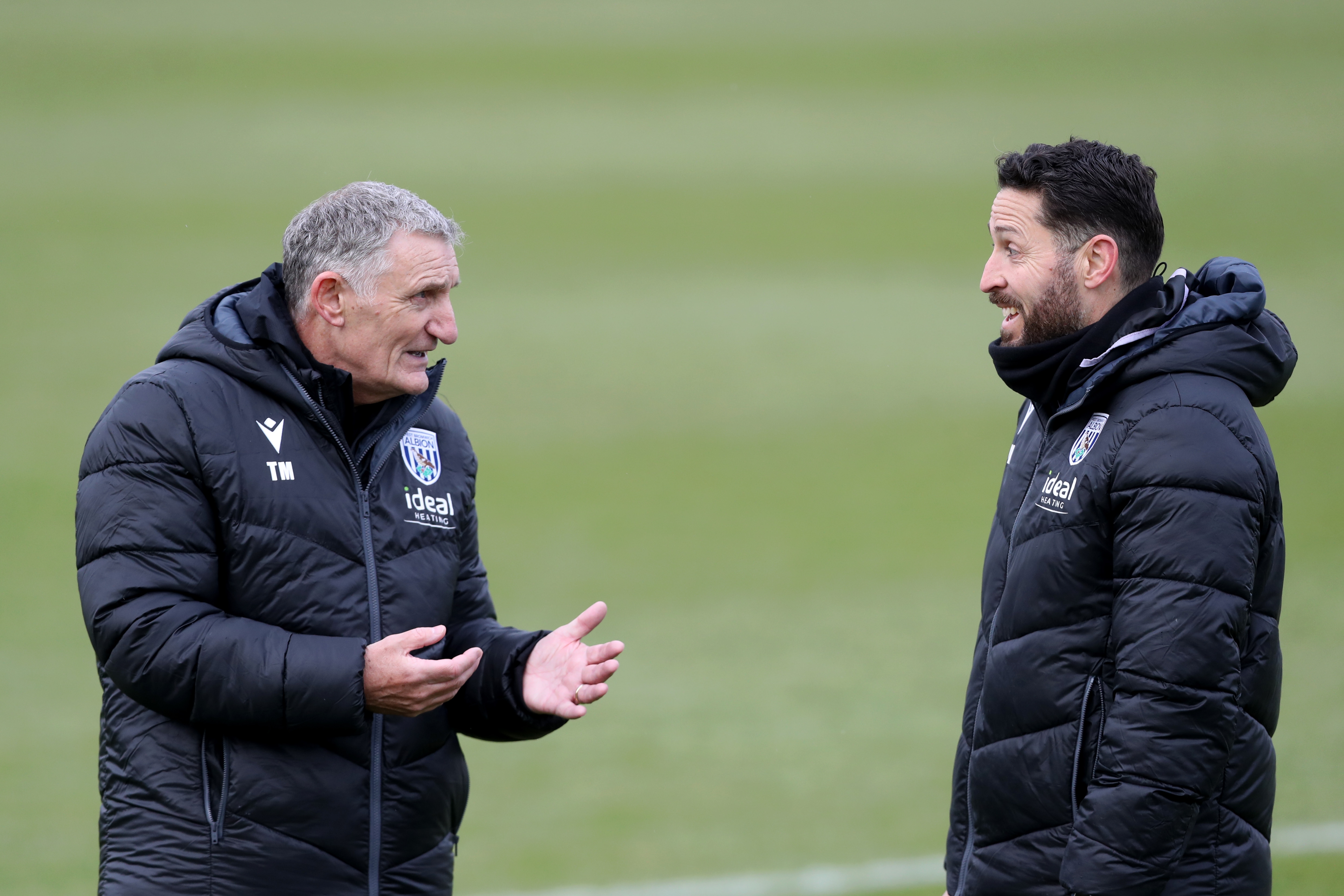 Tony Mowbray chatting to Damia Abella during a training session