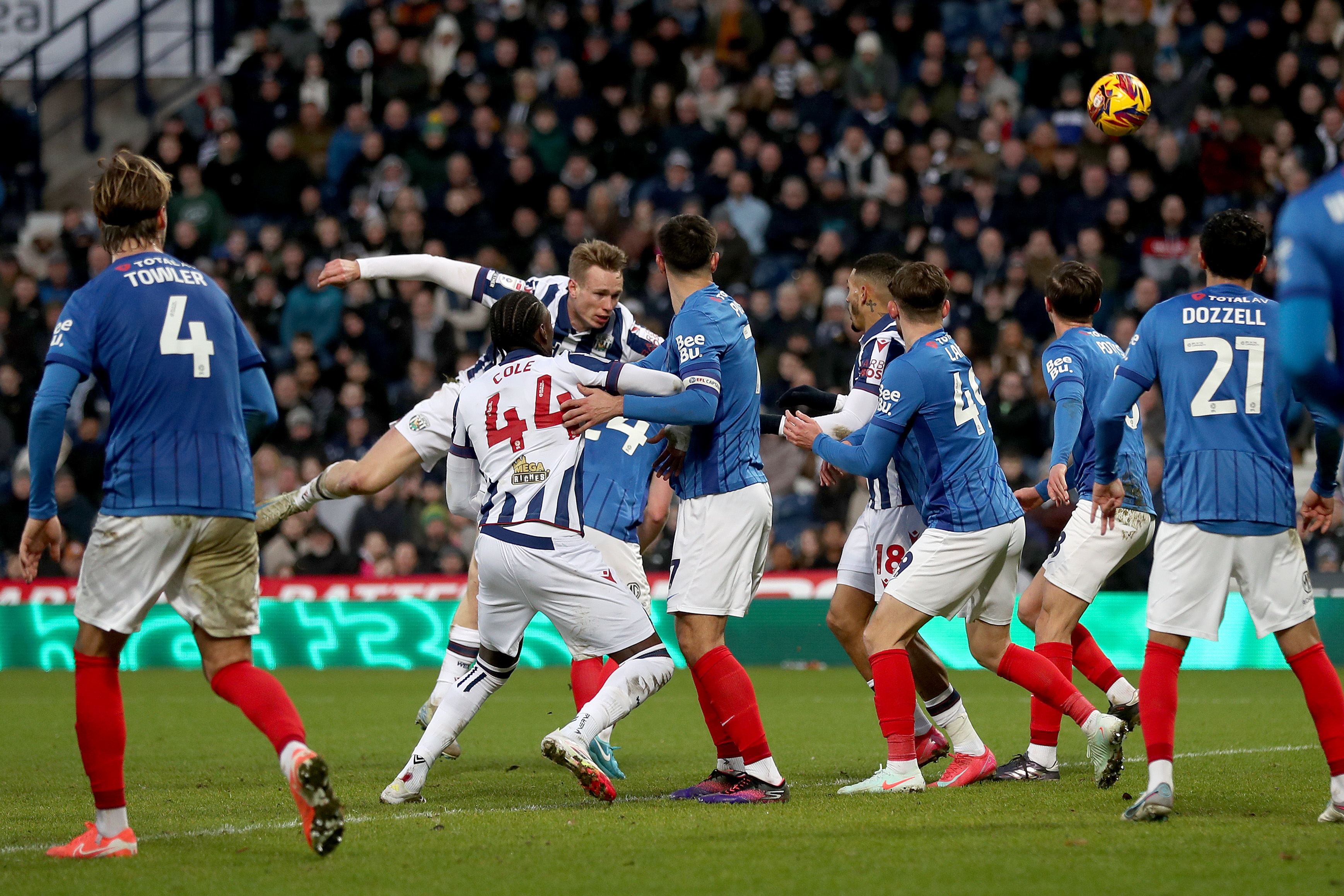 Plenty of Albion and Portsmouth players battling for the ball in the penalty area