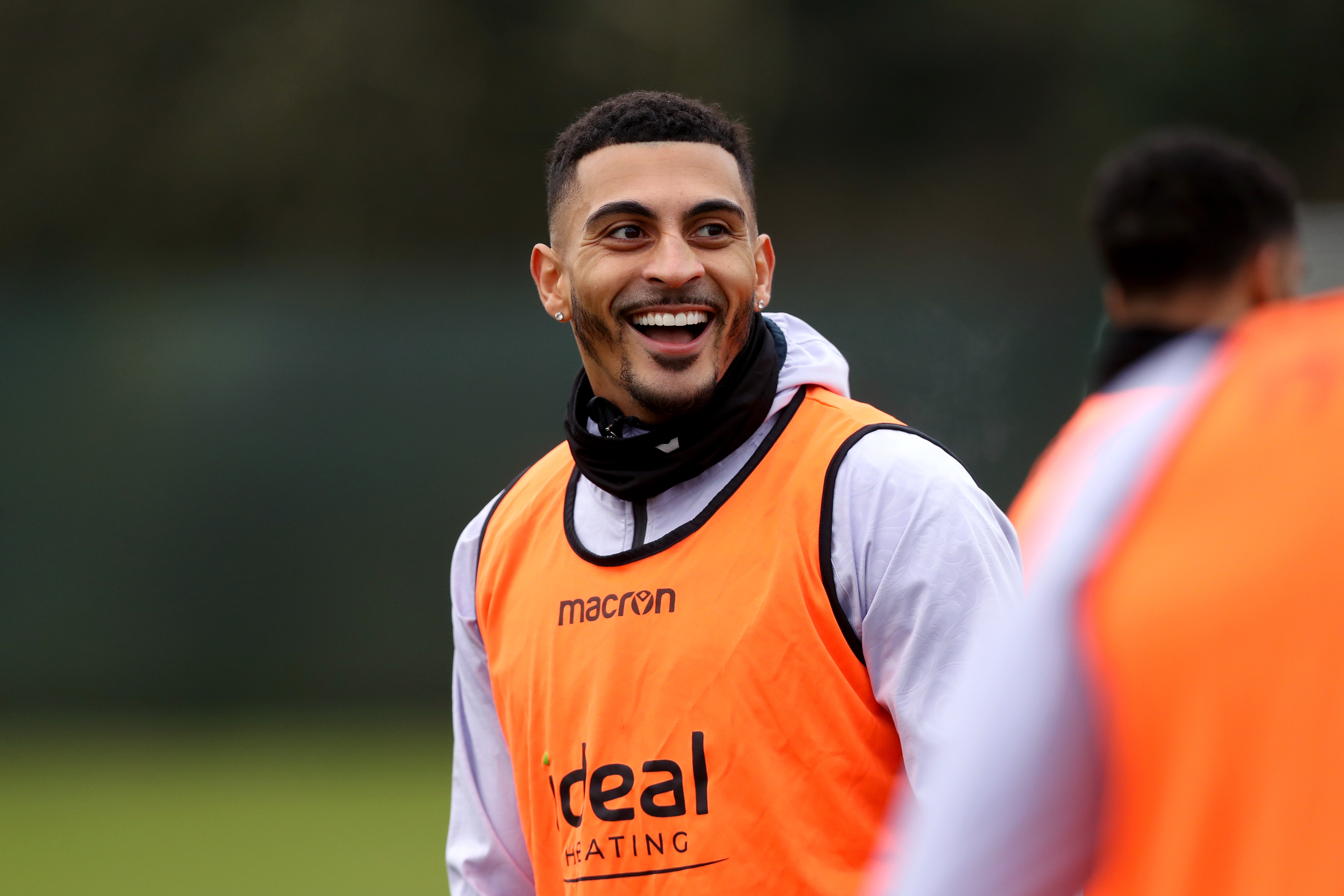 Karlan Grant laughing during a training session