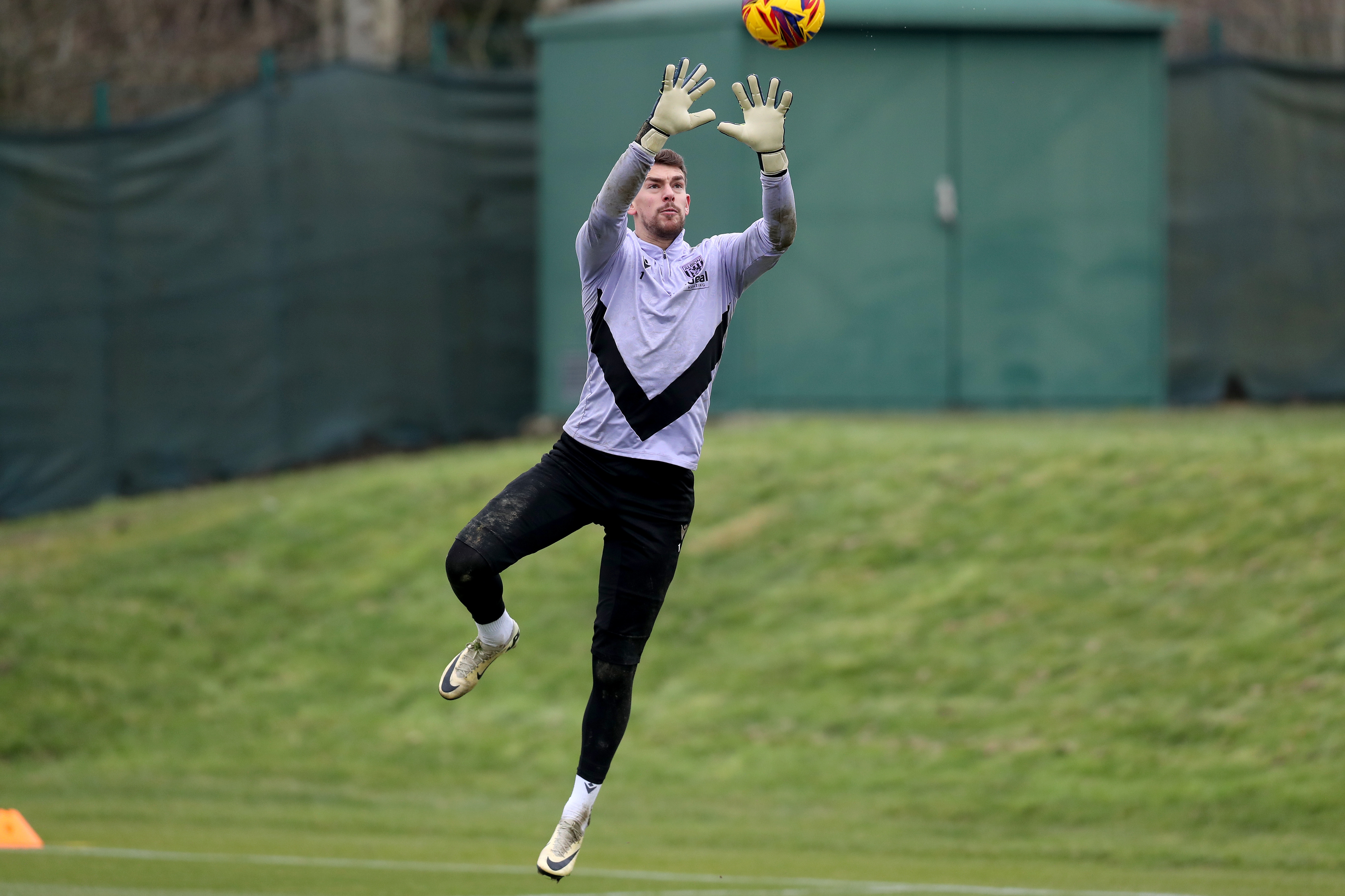 Alex Palmer catching the ball during a training session