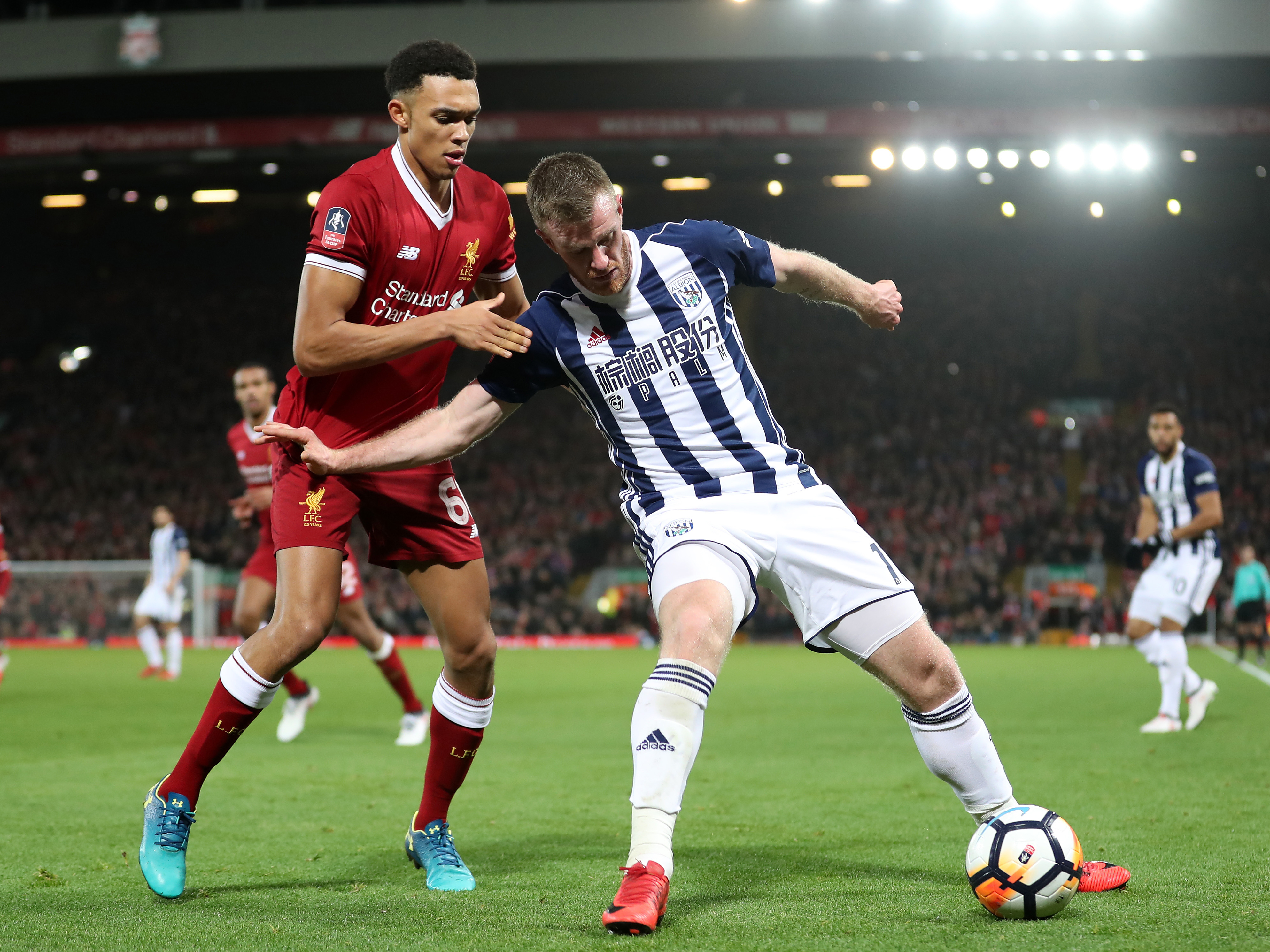 An image of Chris Brunt battling Trent Alexander-Arnold for the ball against Liverpool in the FA Cup