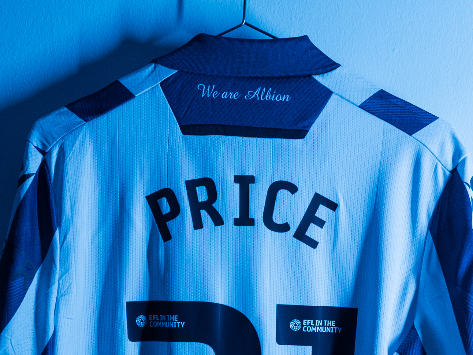 Isaac Price's home shirt hanging in the dressing room