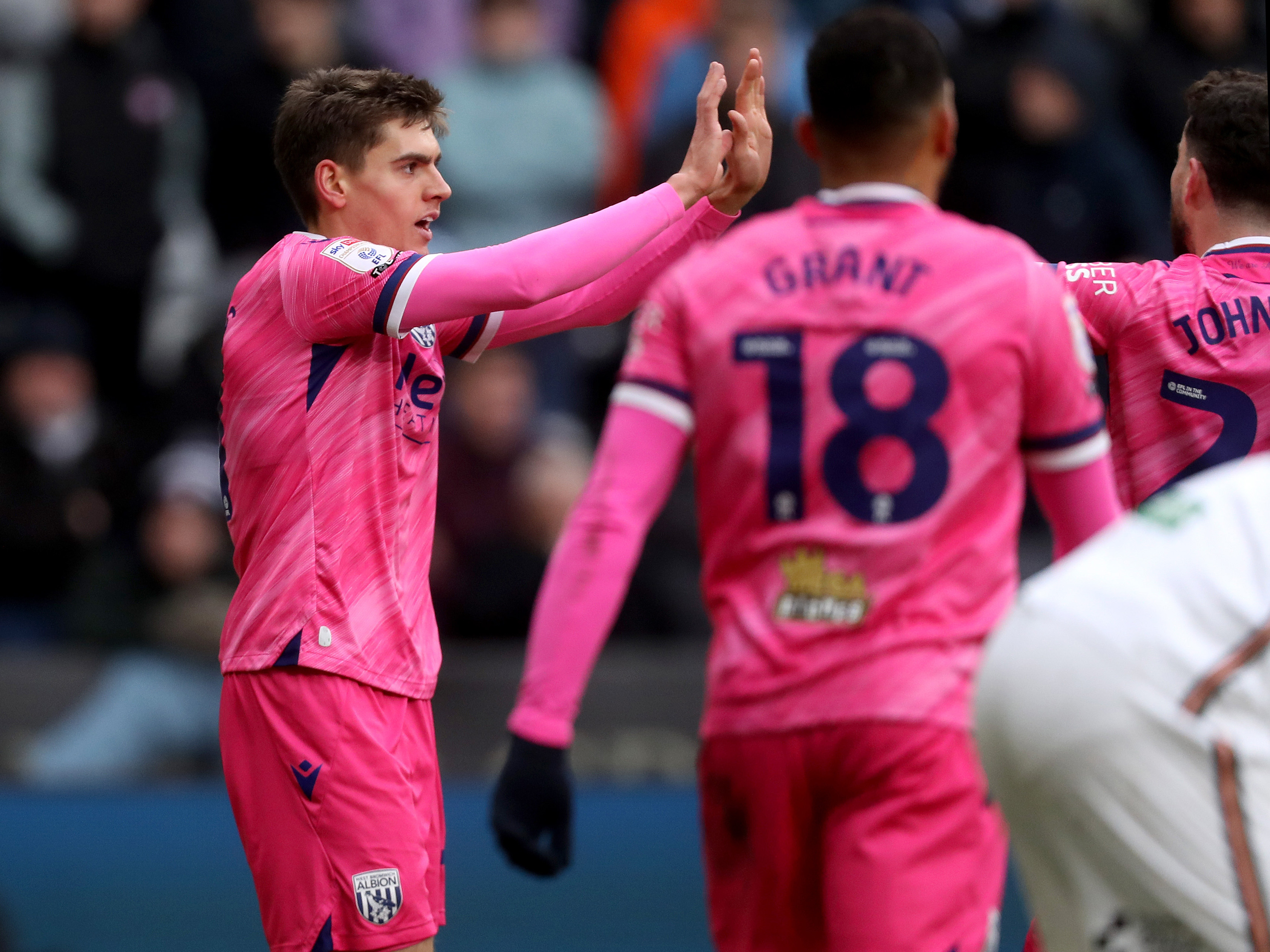 An image of Tom Fellows celebrating his goal against Swansea with his teammates