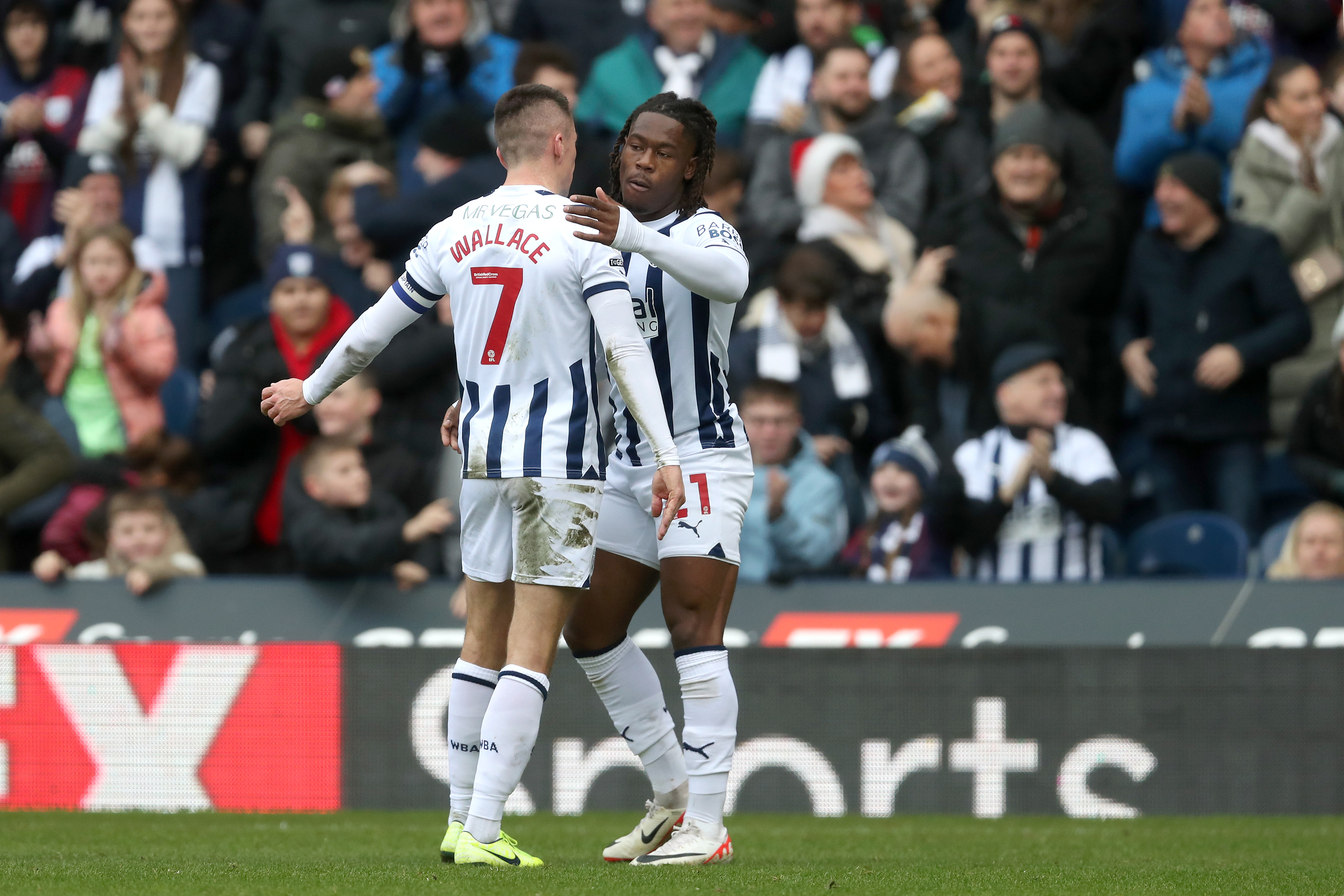 Brandon Thomas-Asante celebrates scoring against Stoke City with Jed Wallace at The Hawthorns in December 2023