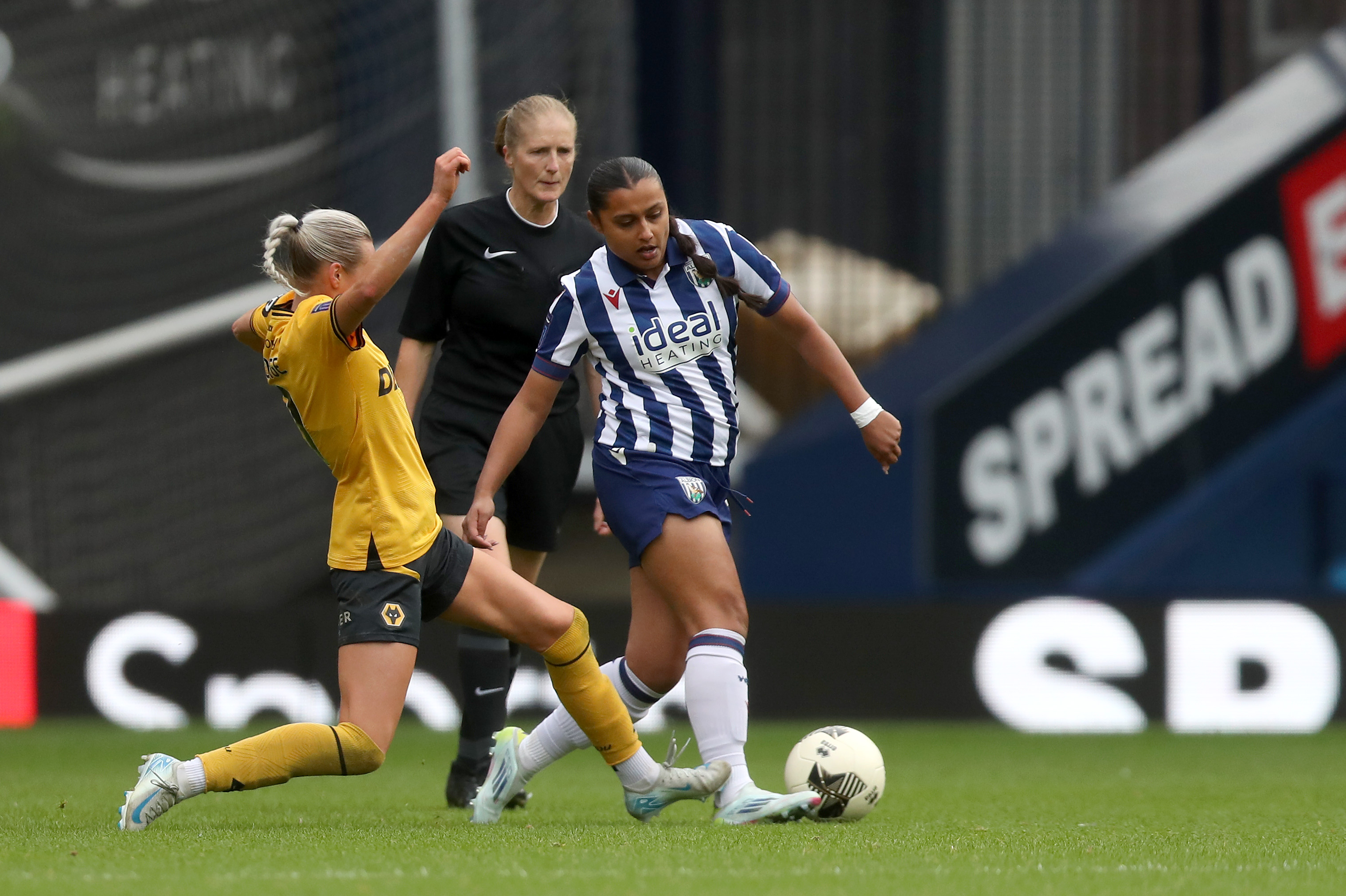 Simran Jhamat in action for Albion Women wearing the home kit 