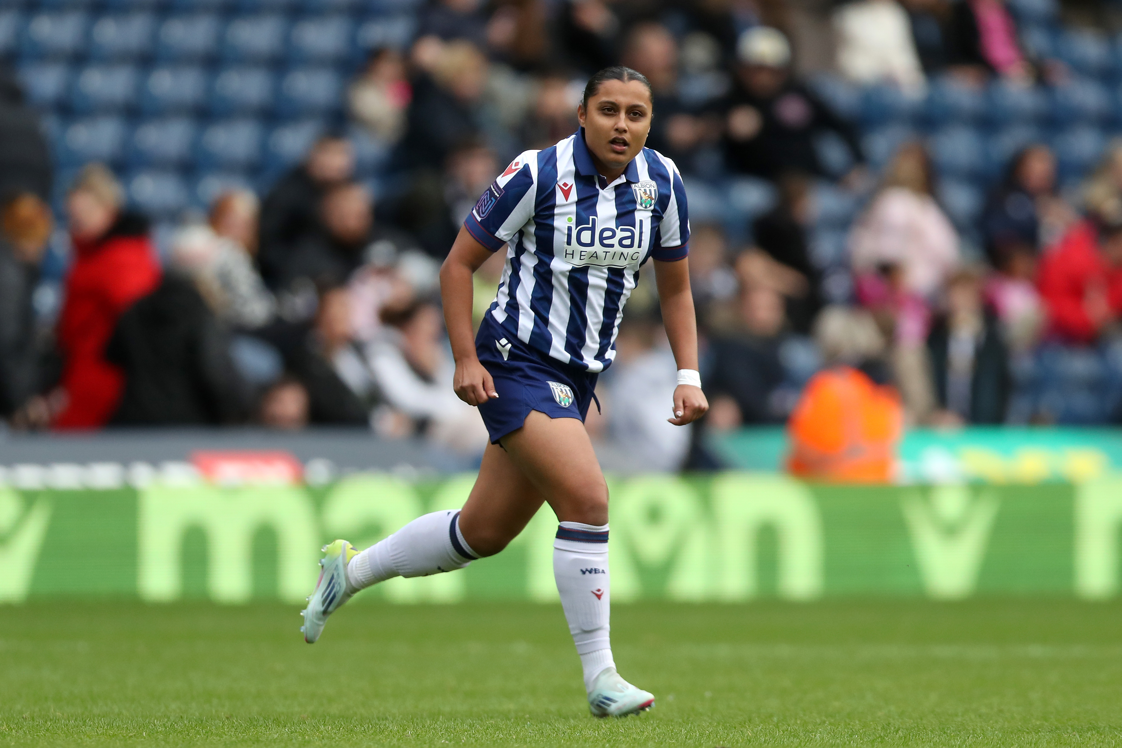 Simran Jhamat in action for Albion at The Hawthorns in the home kit 