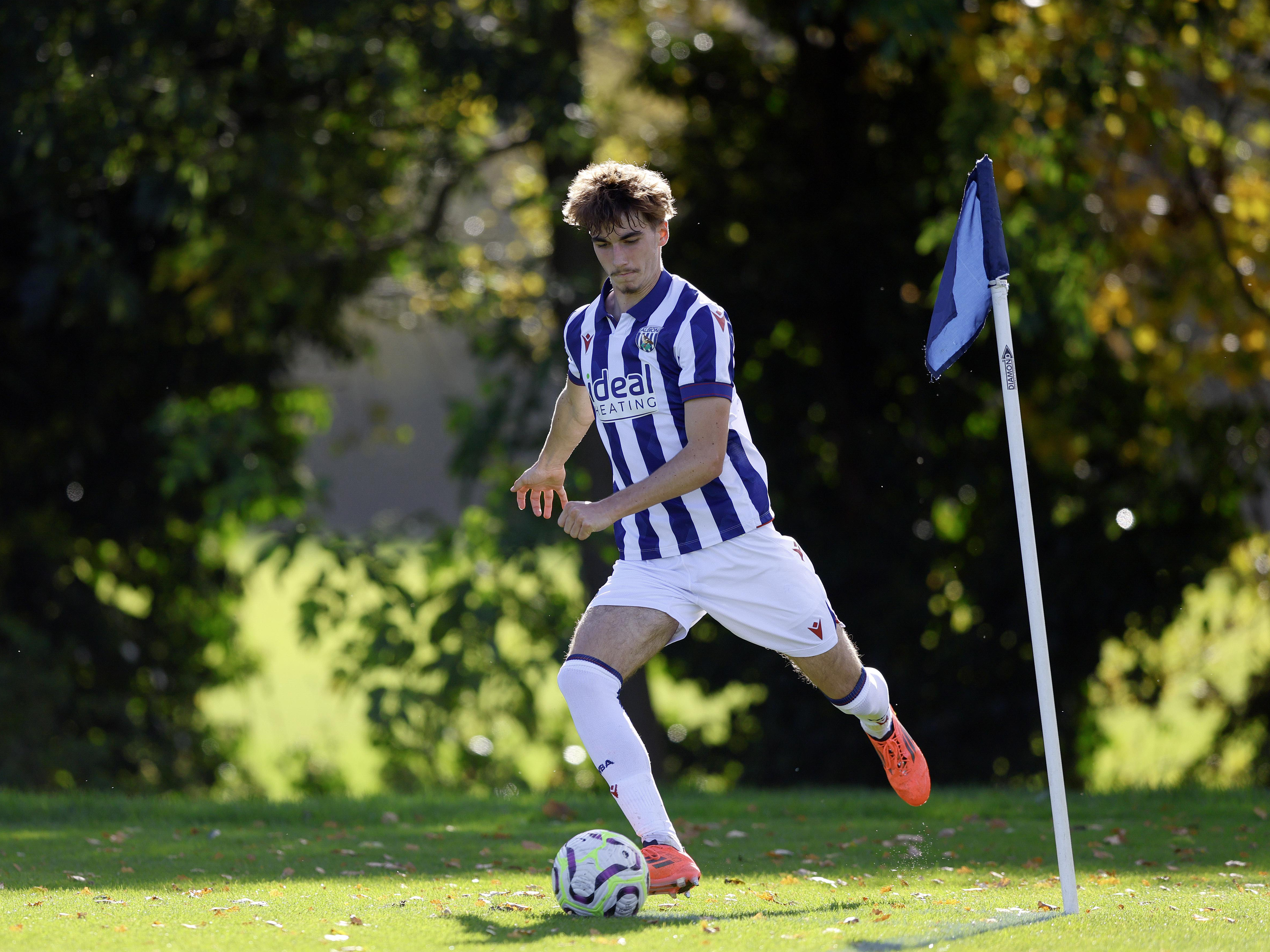 Alfie Maughan taking a corner for Albion U18s in the home kit 