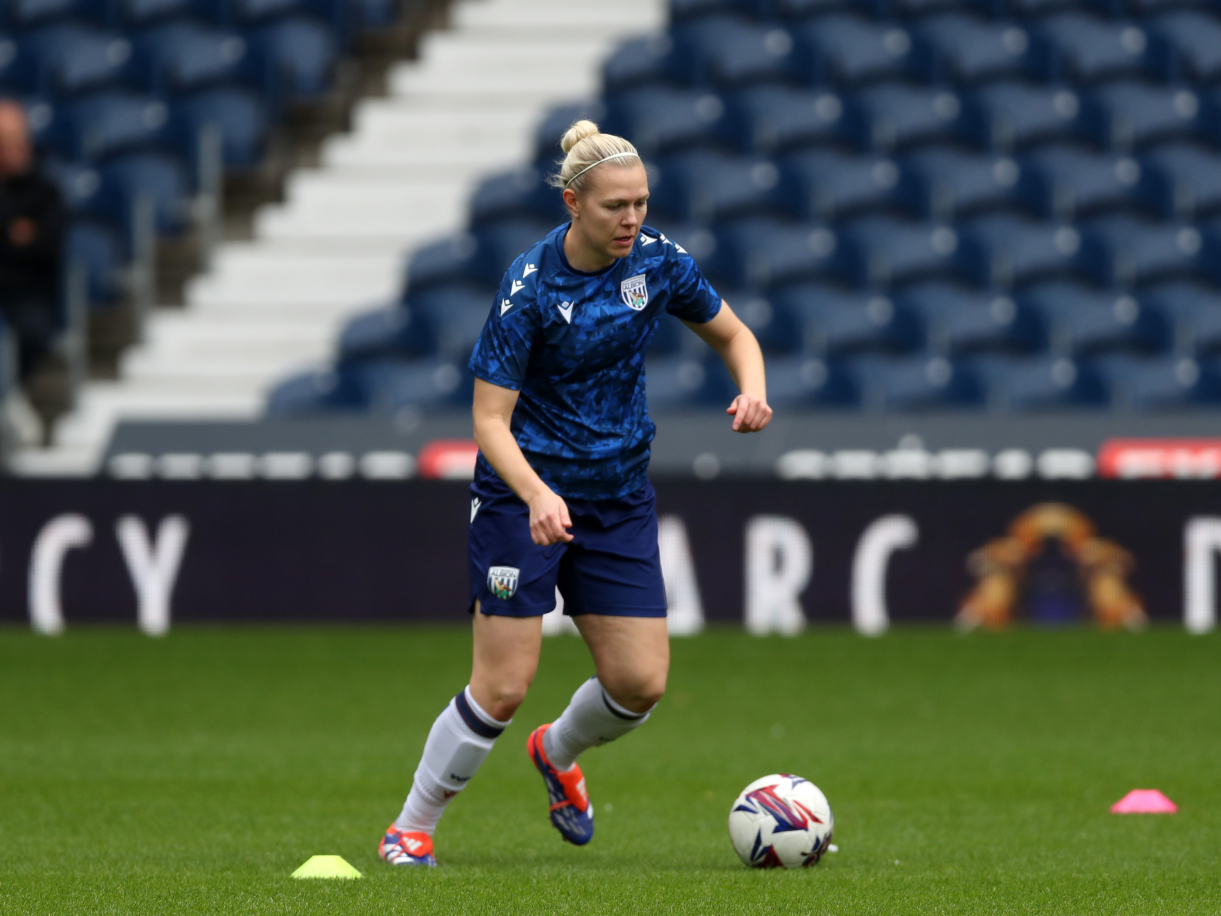 An image of Hannah George warming up before a match