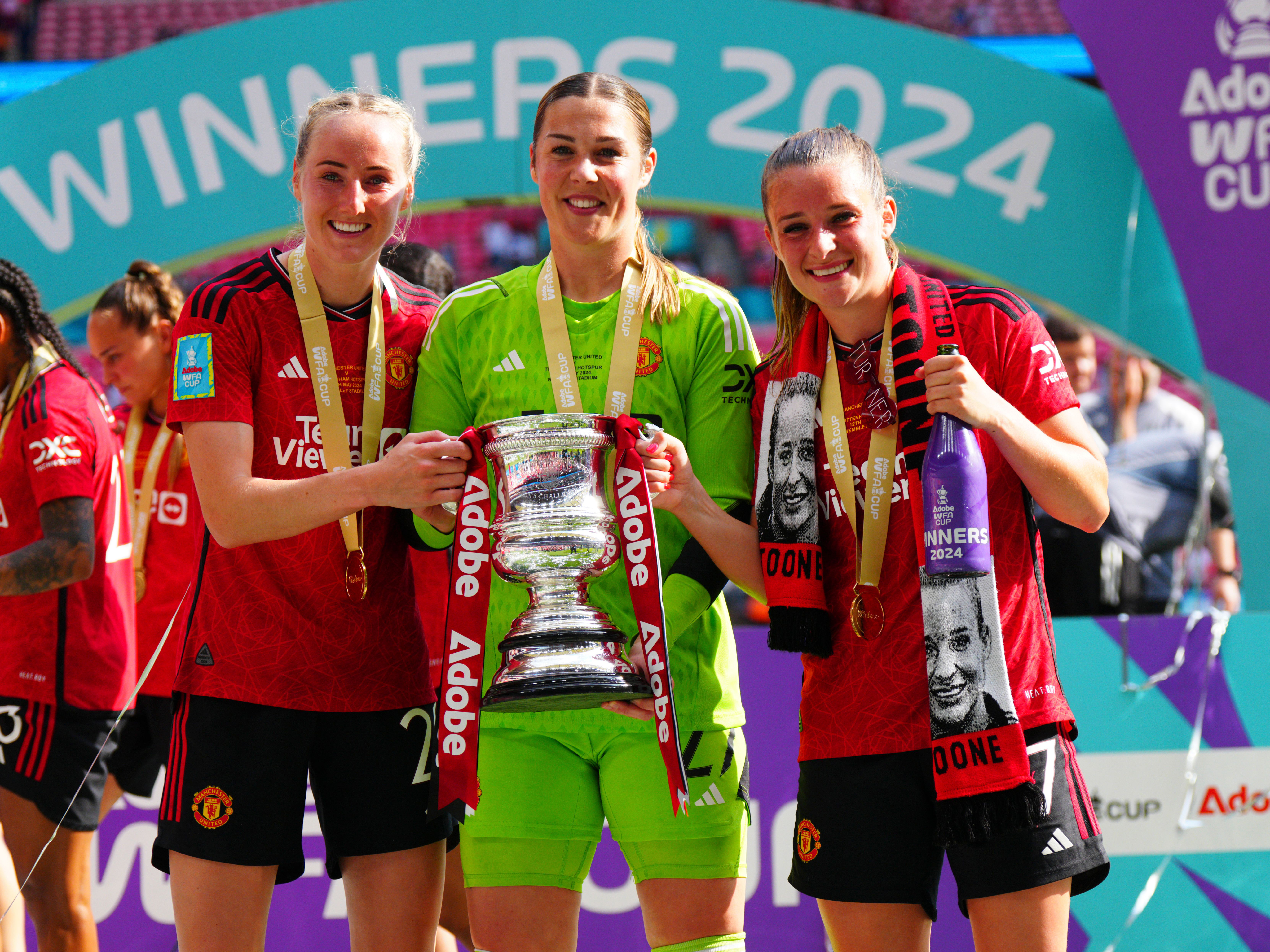 An image of Millie Turner, Mary Earps and Ella Toone after winning last season's Women's FA Cup 