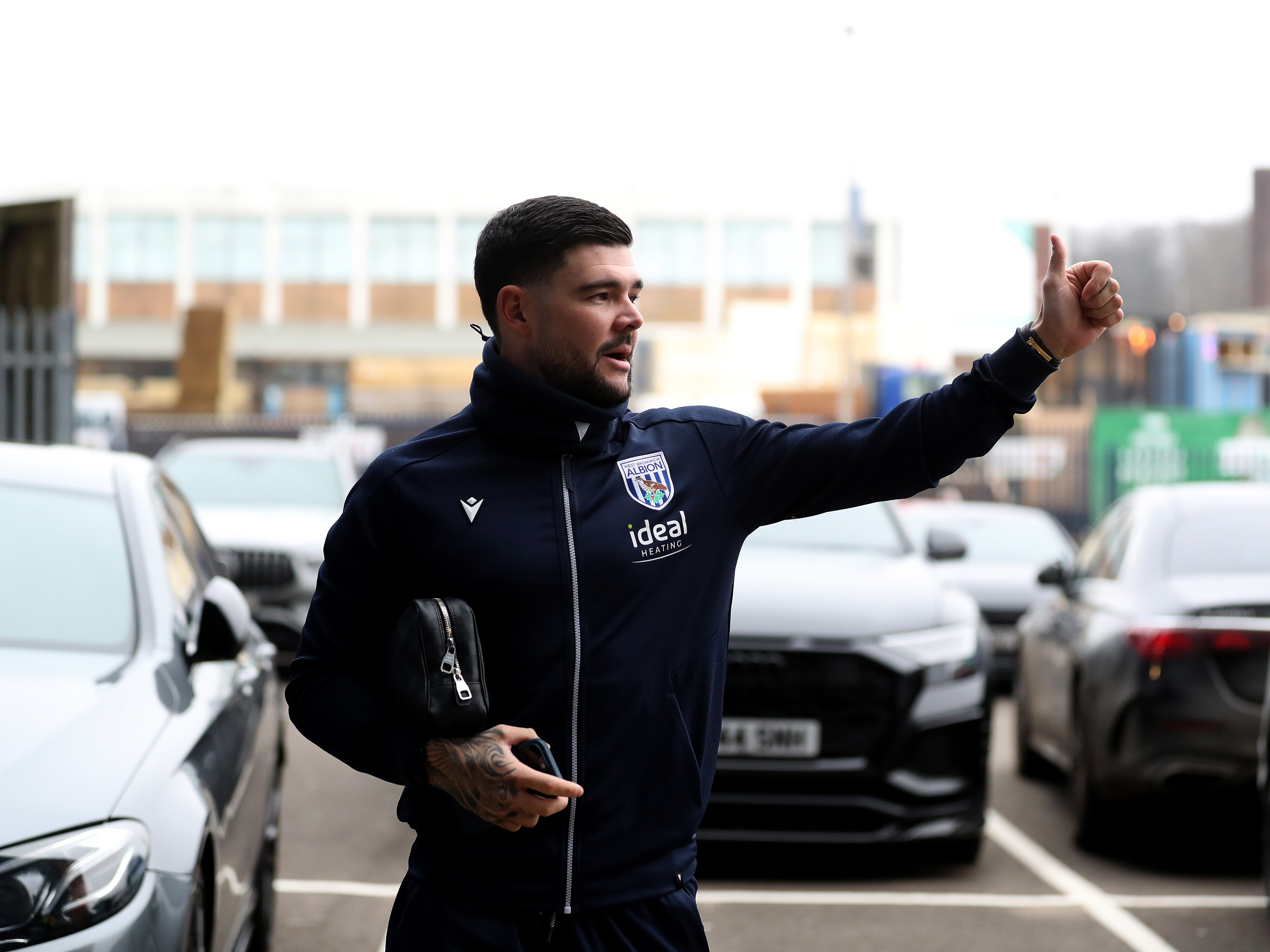 A photo of Alex Mowatt giving fans a thumbs up at The Hawthorns upon arrival