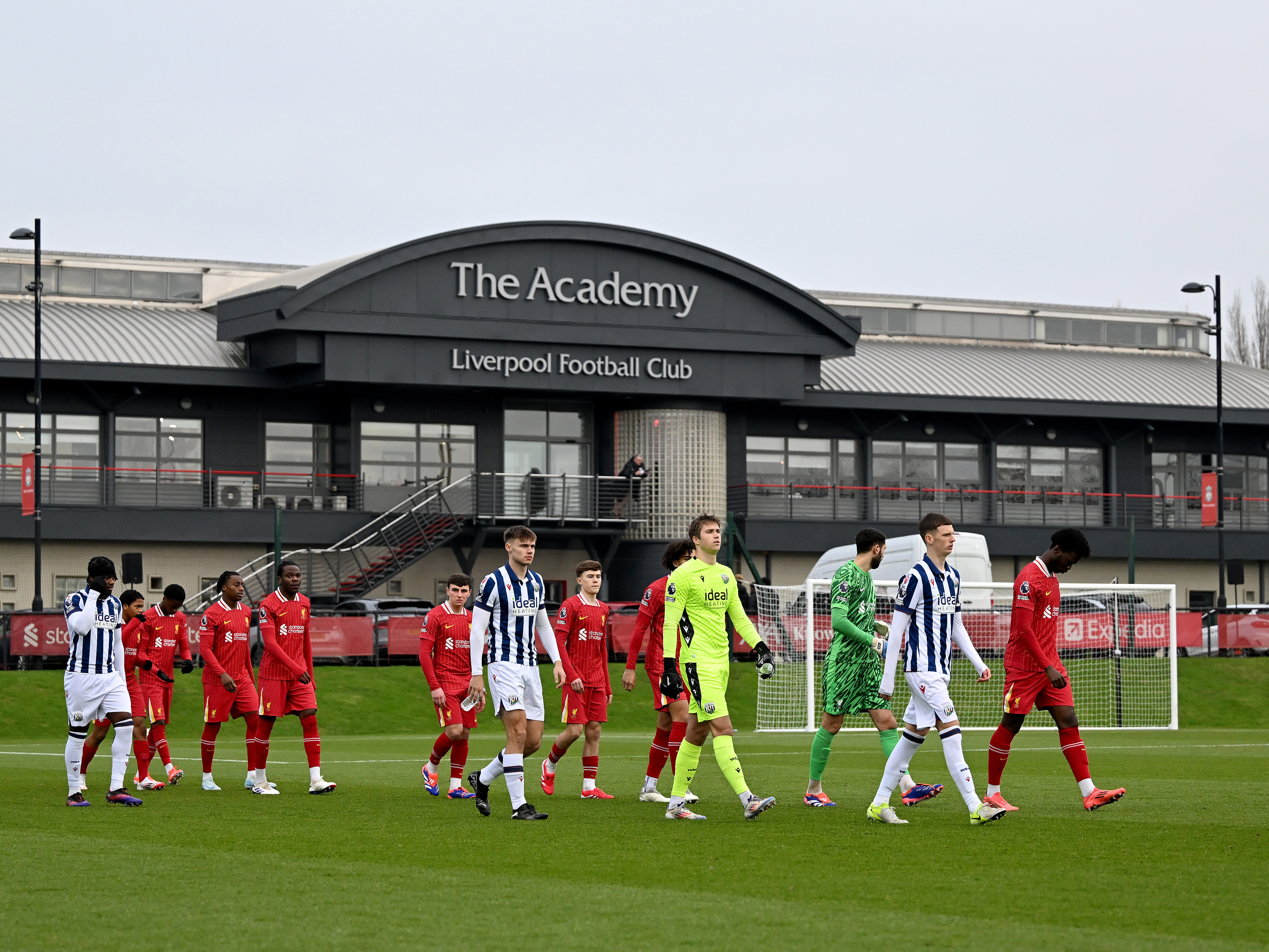 A photo of Albion's PL2 team walking out at the Liverpool Academy before an U21 game