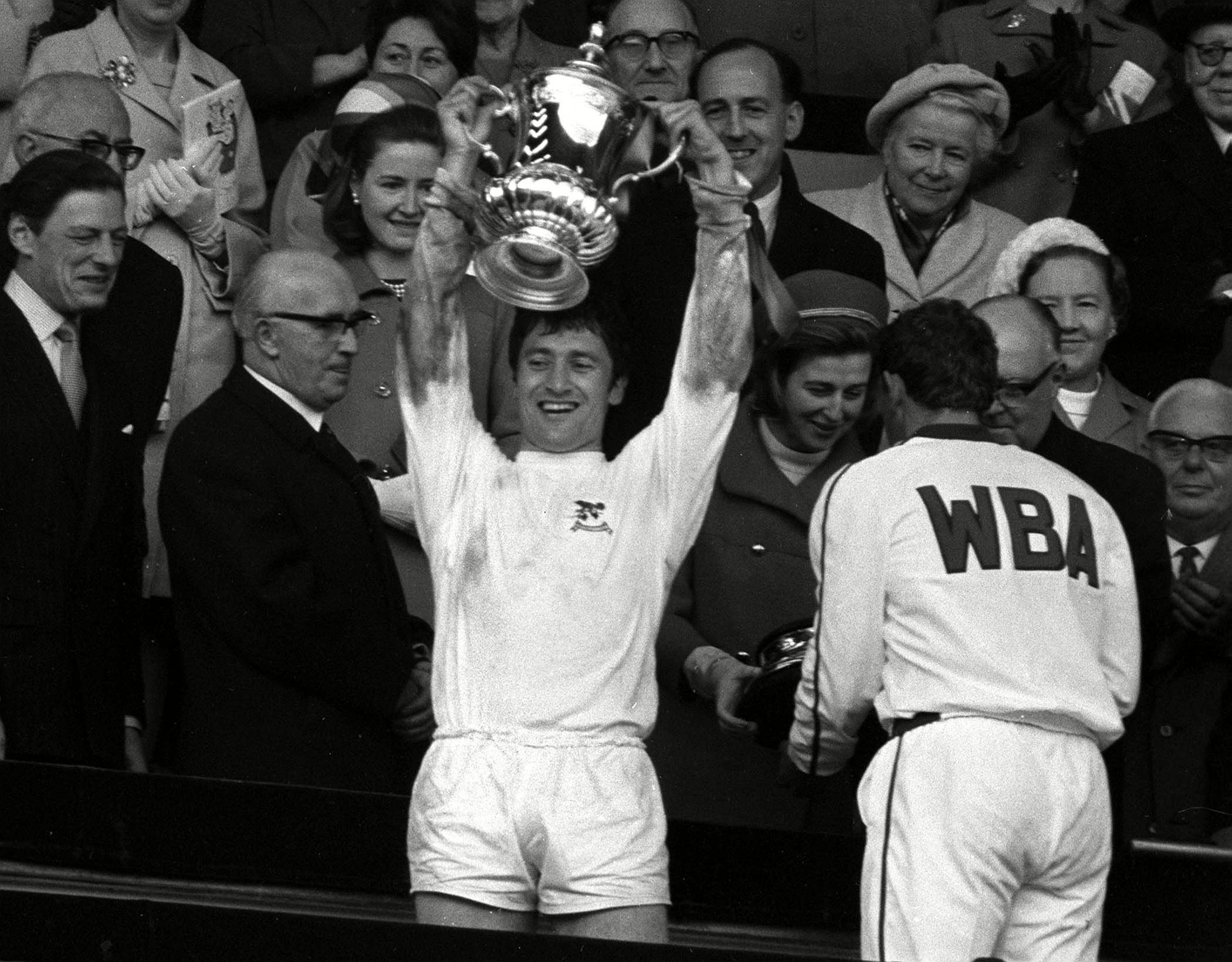 Albion captain Graham Williams lifts the FA Cup trophy in 1968