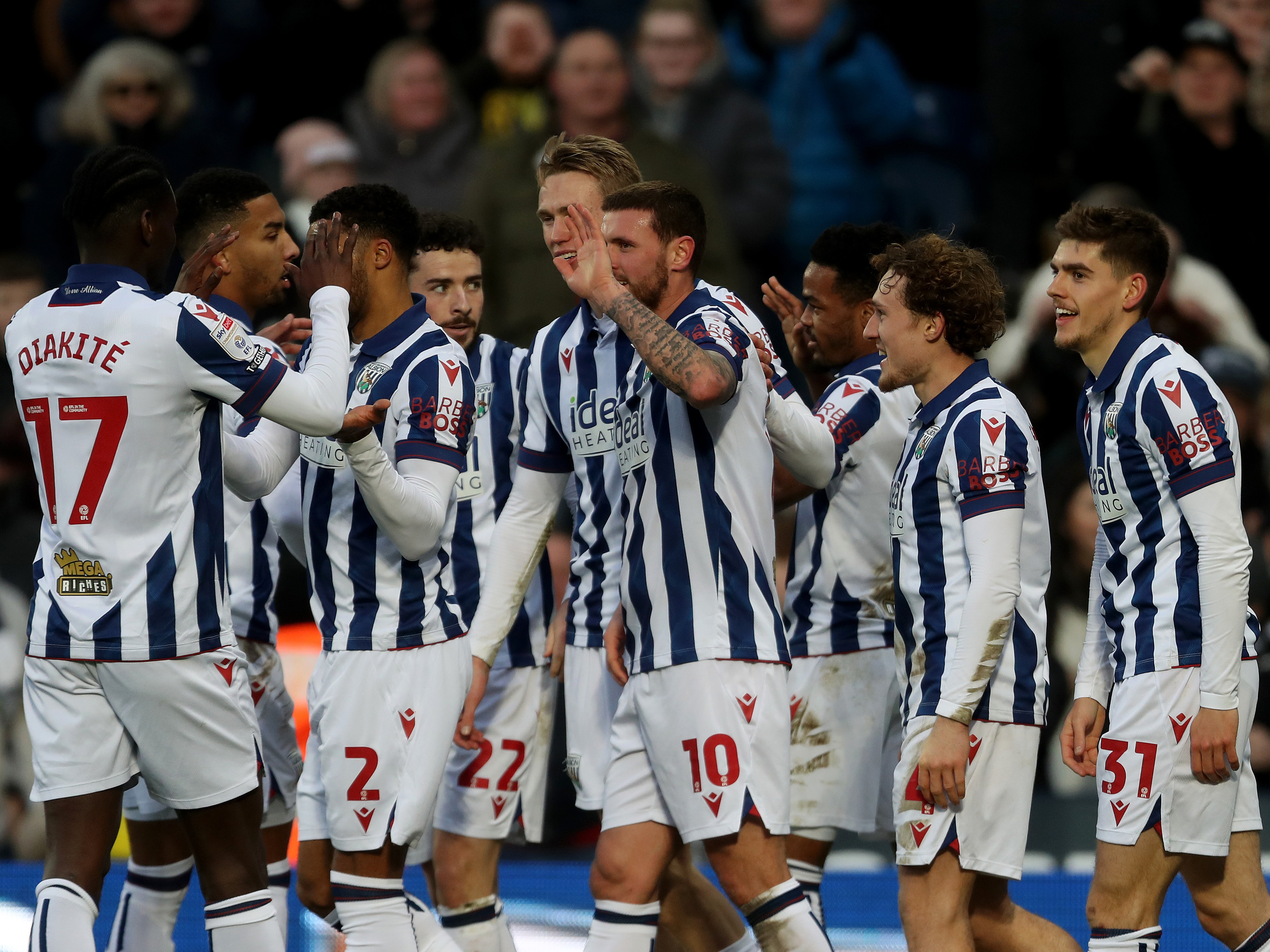 An image of John Swift celebrating his goal with his teammates