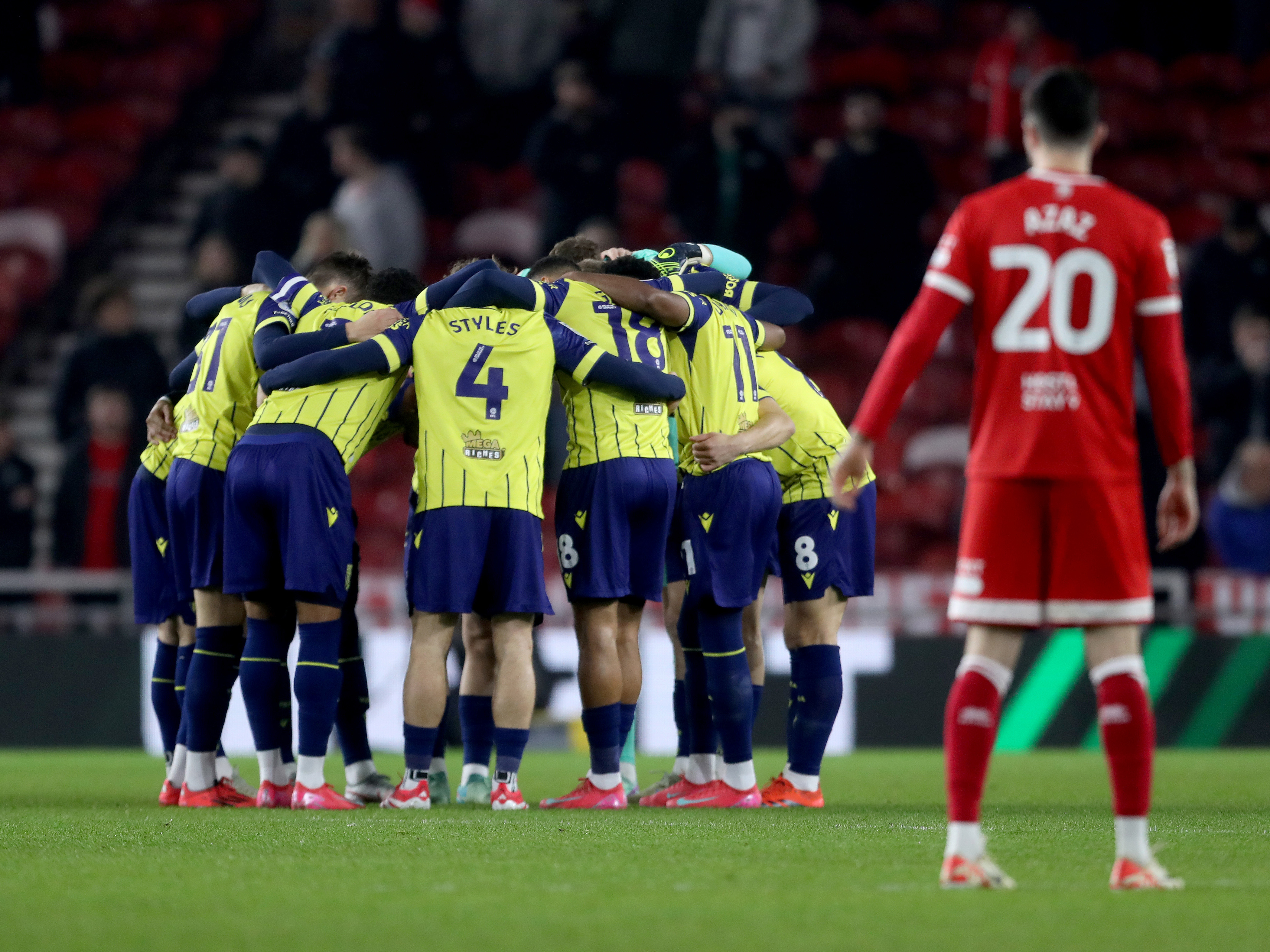 An image of Albion in a team huddle before the Middlesbrough game