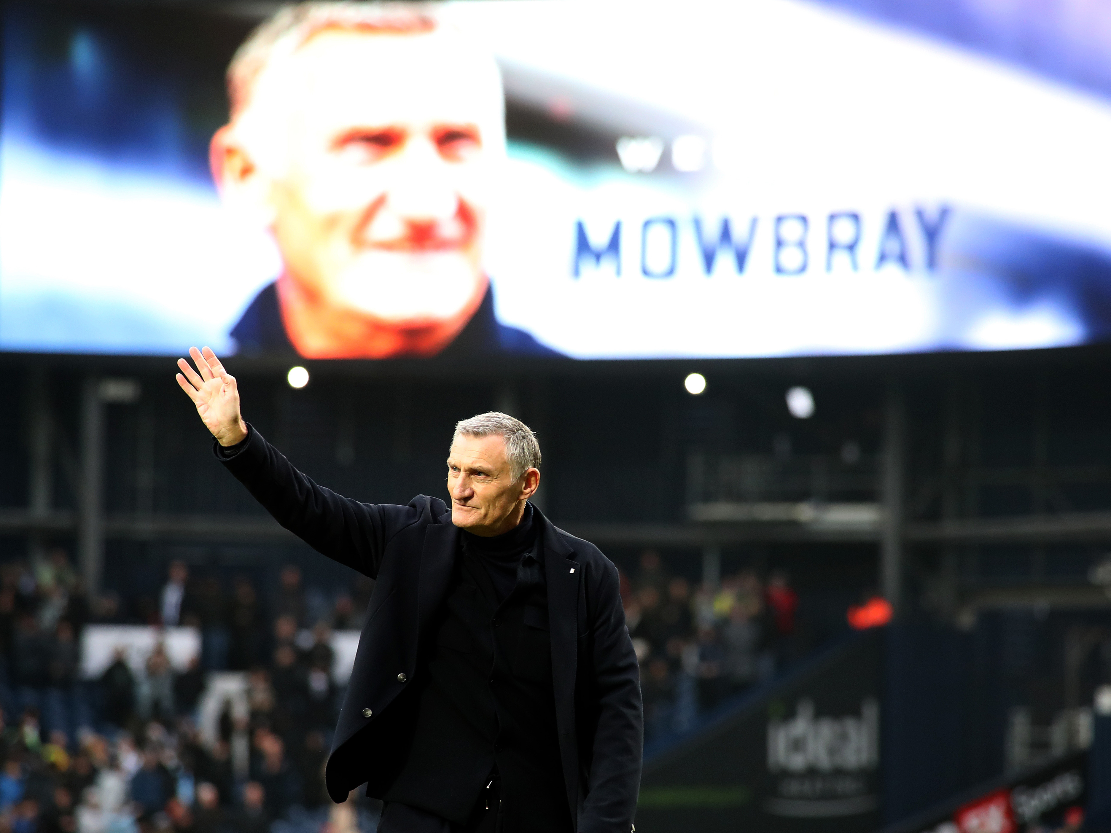 An image of Tony Mowbray waving to the Hawthorns crowd