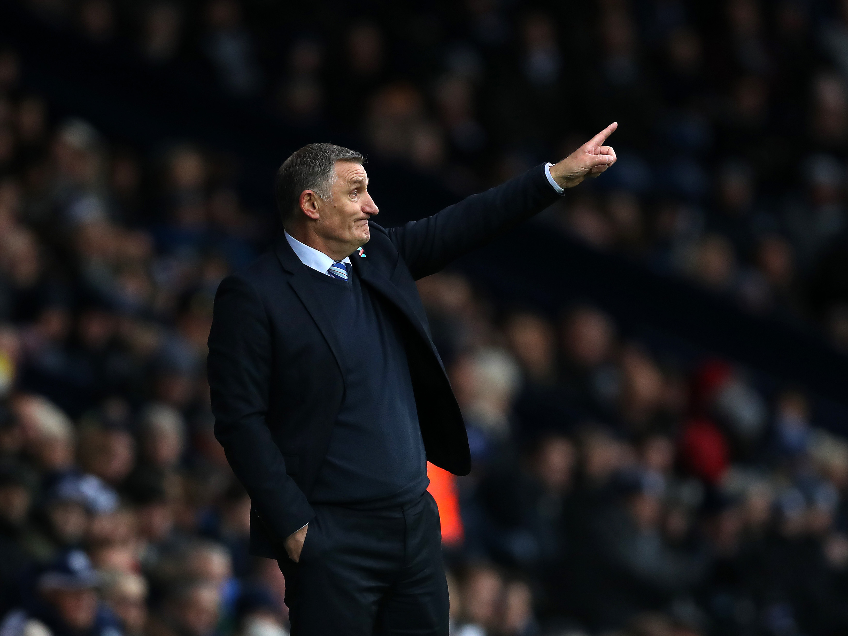 Tony Mowbray on the side of a pitch pointing