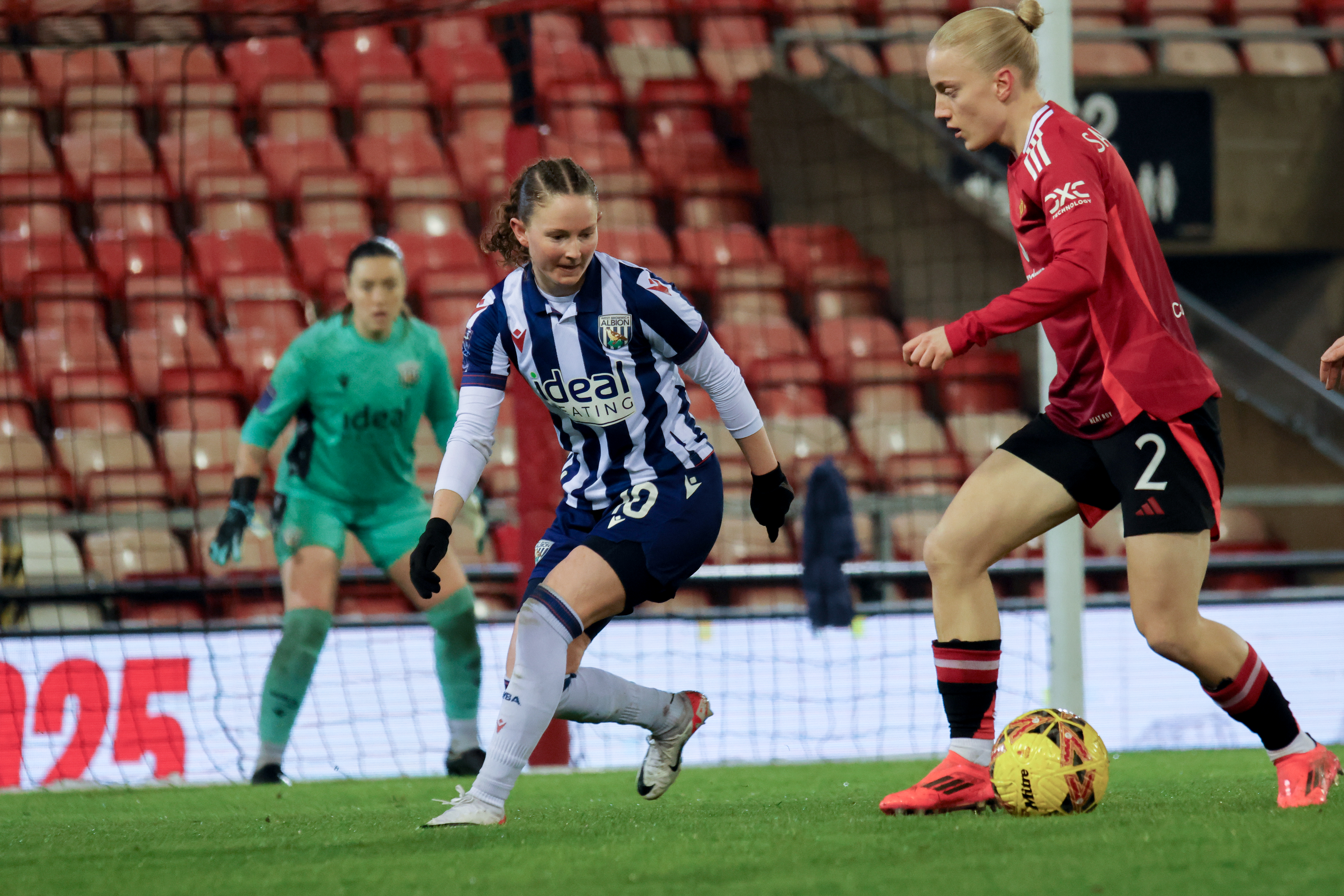 Olivia Rabjohn in action for Albion in the home kit against Manchester United