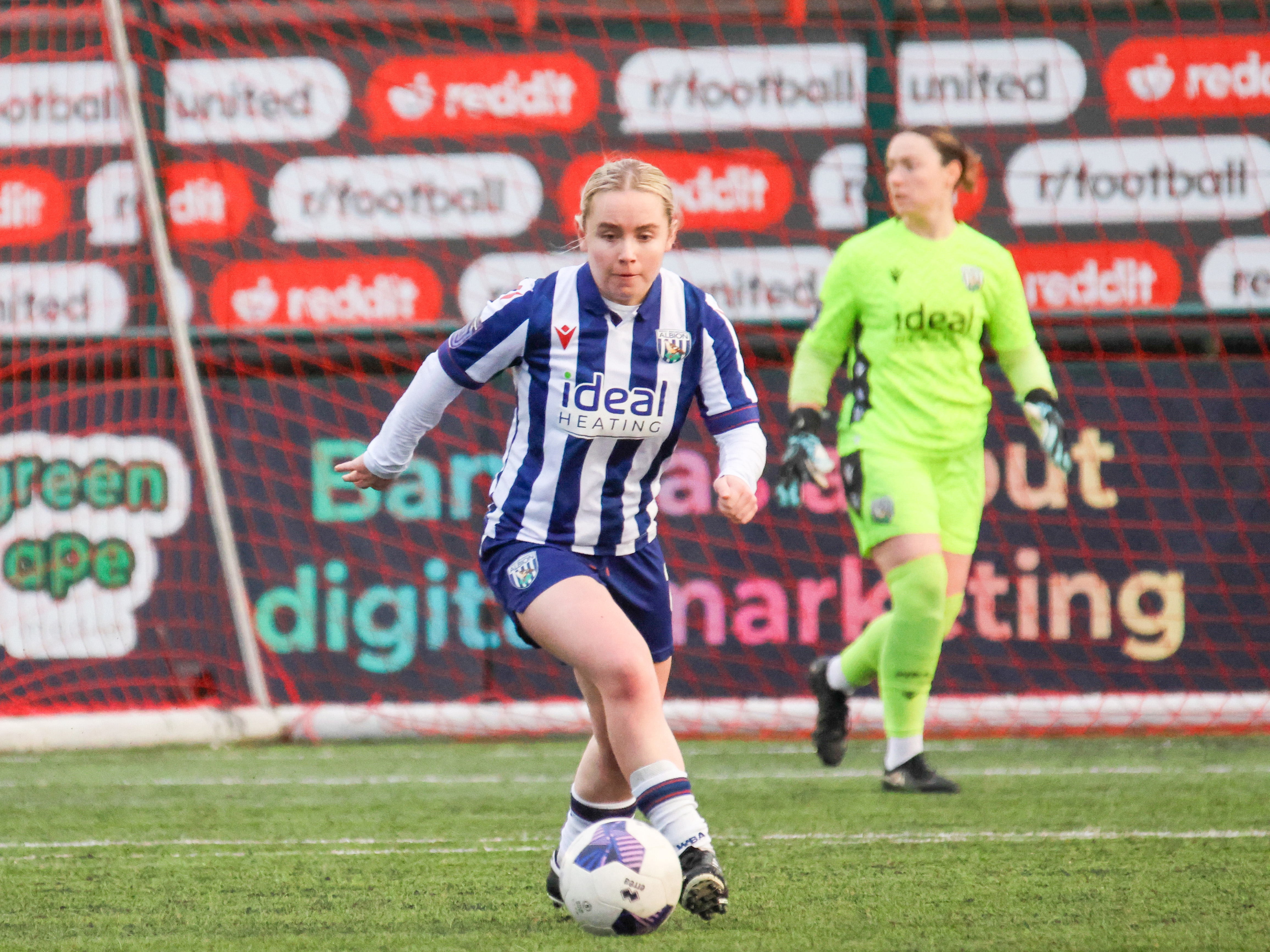 Ella Haughey on the ball for Albion Women in the home kit 