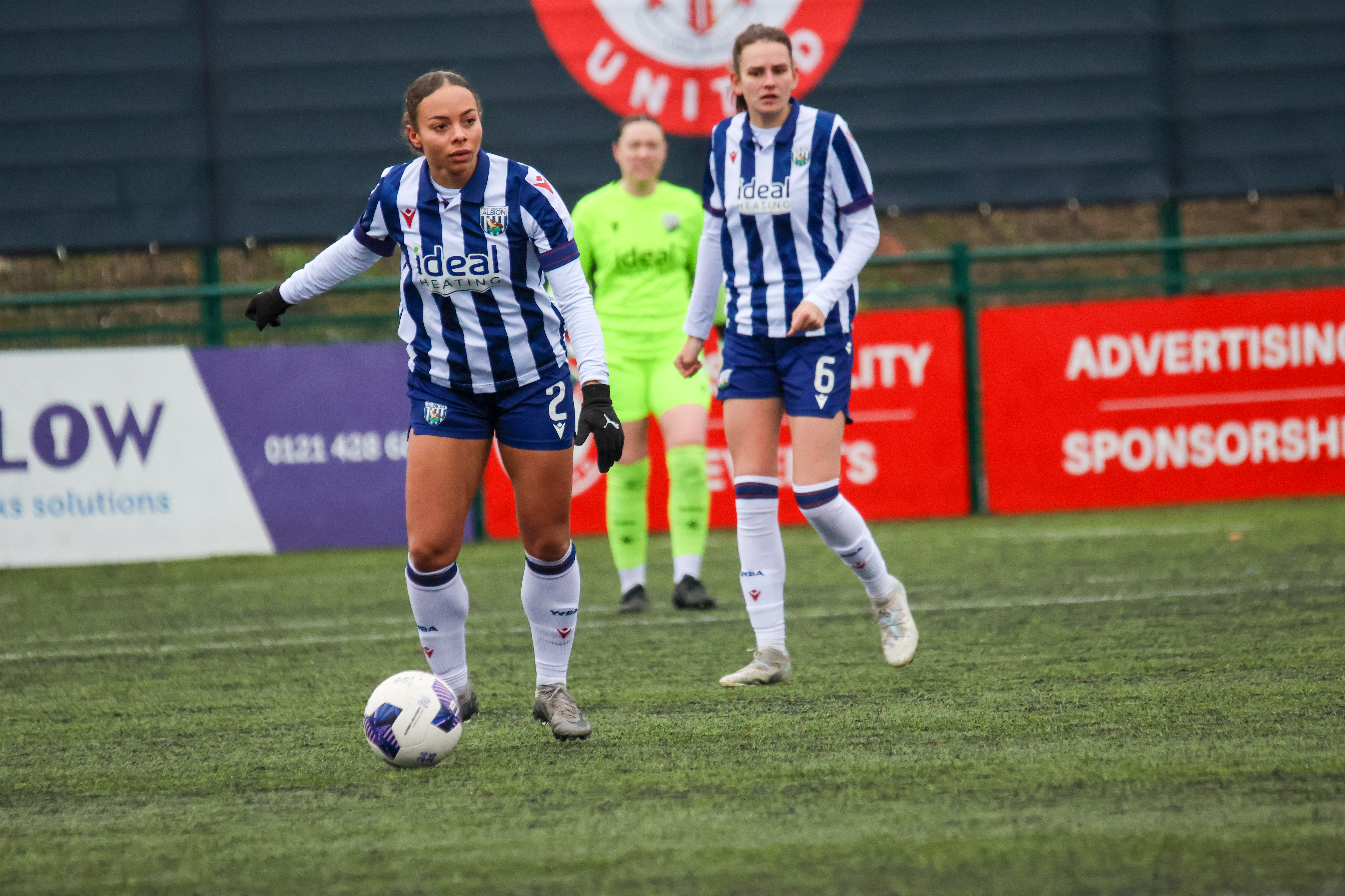 Ash Brown on the ball for Albion Women in the home kit 