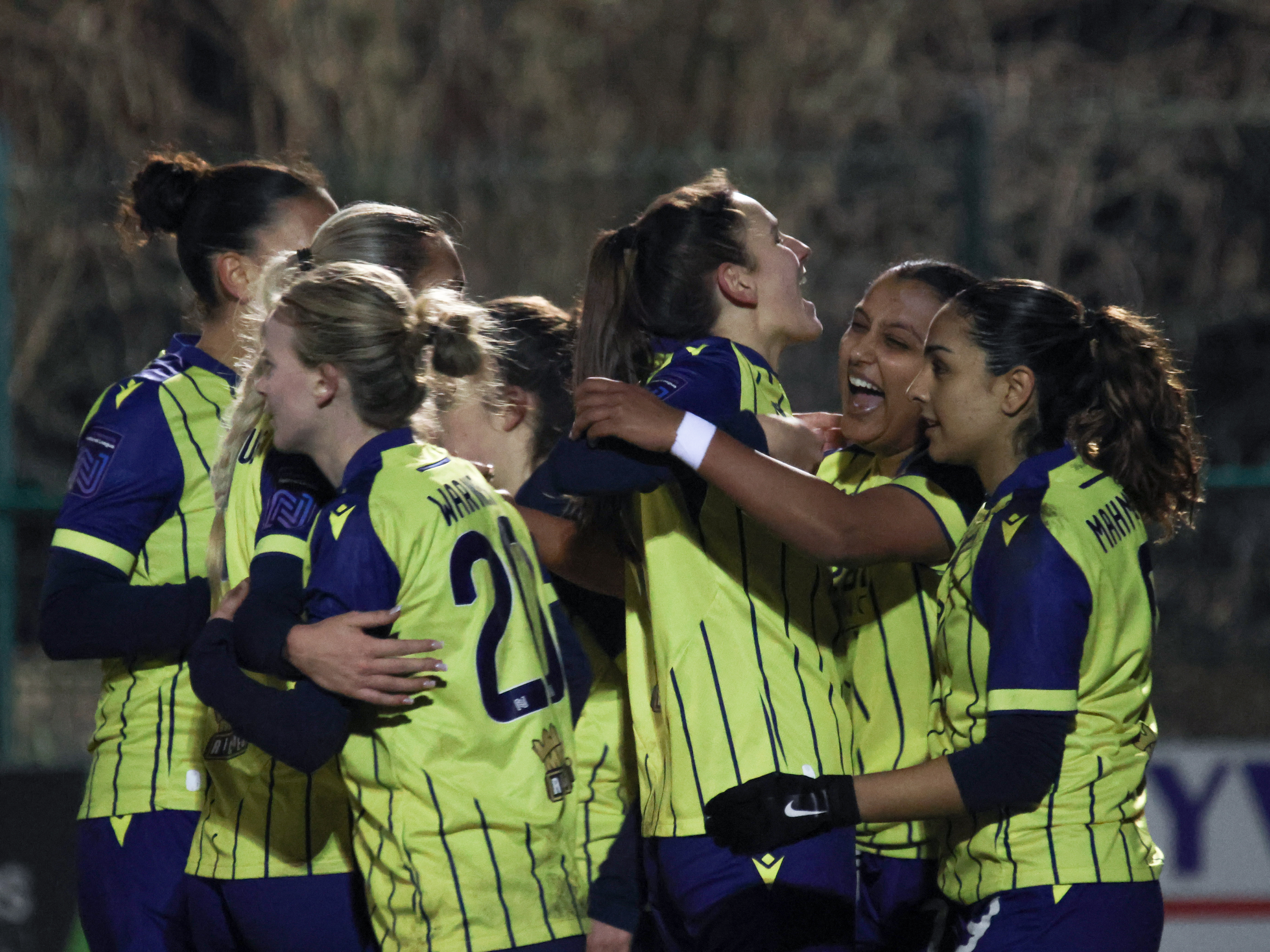 Albion women celebrate.