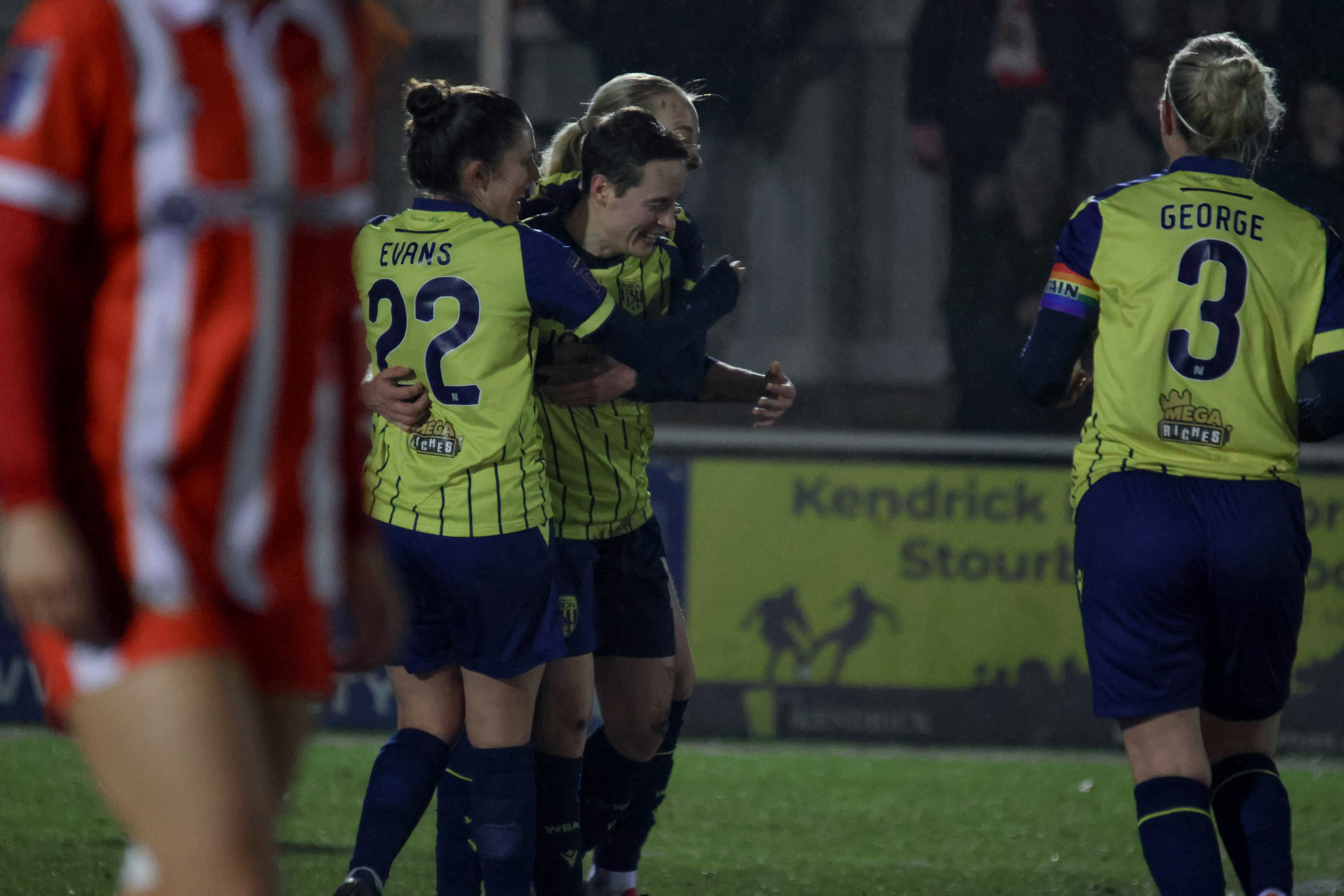 Albion women celebrate.