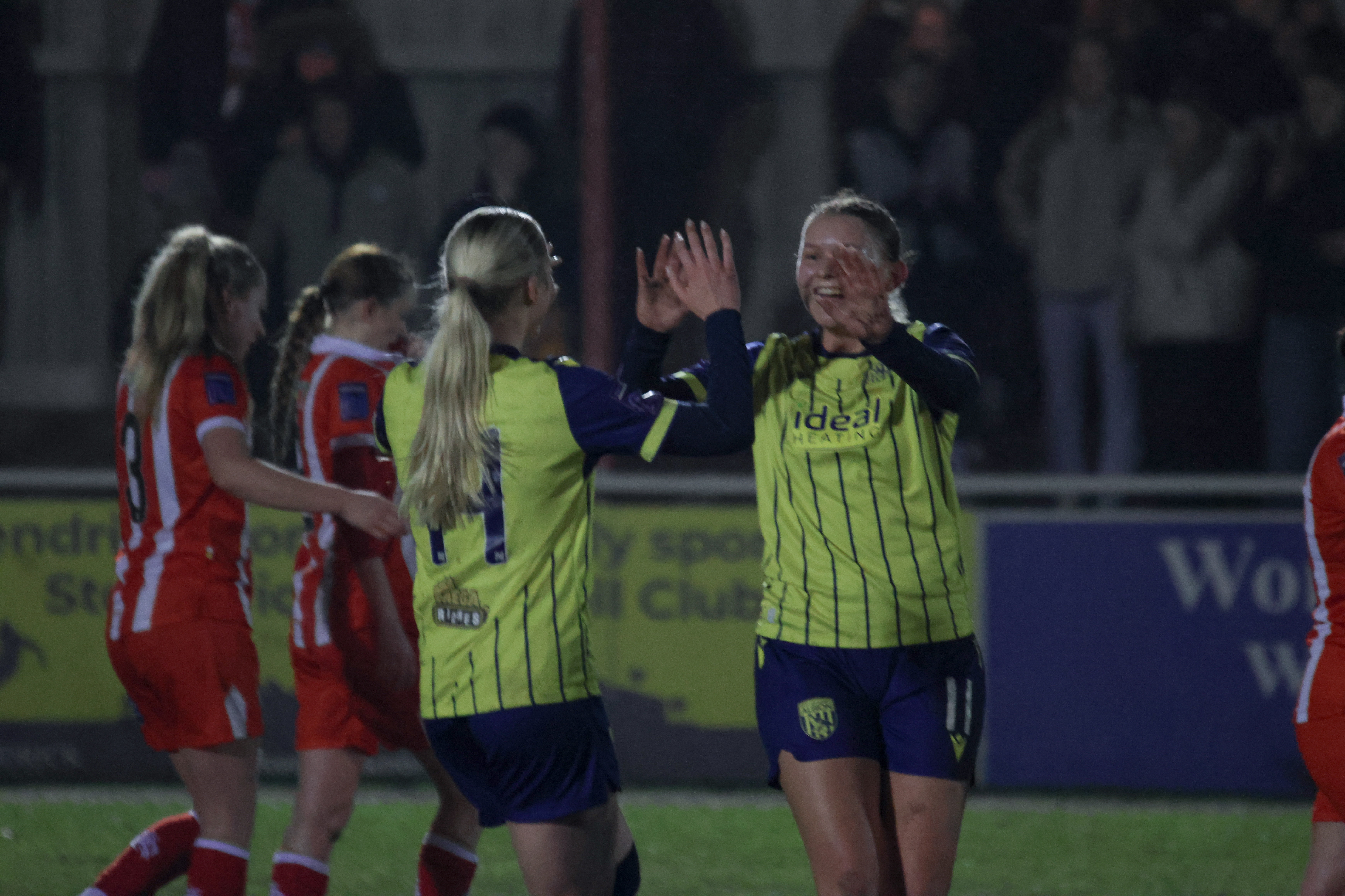 Albion Women players celebrate.