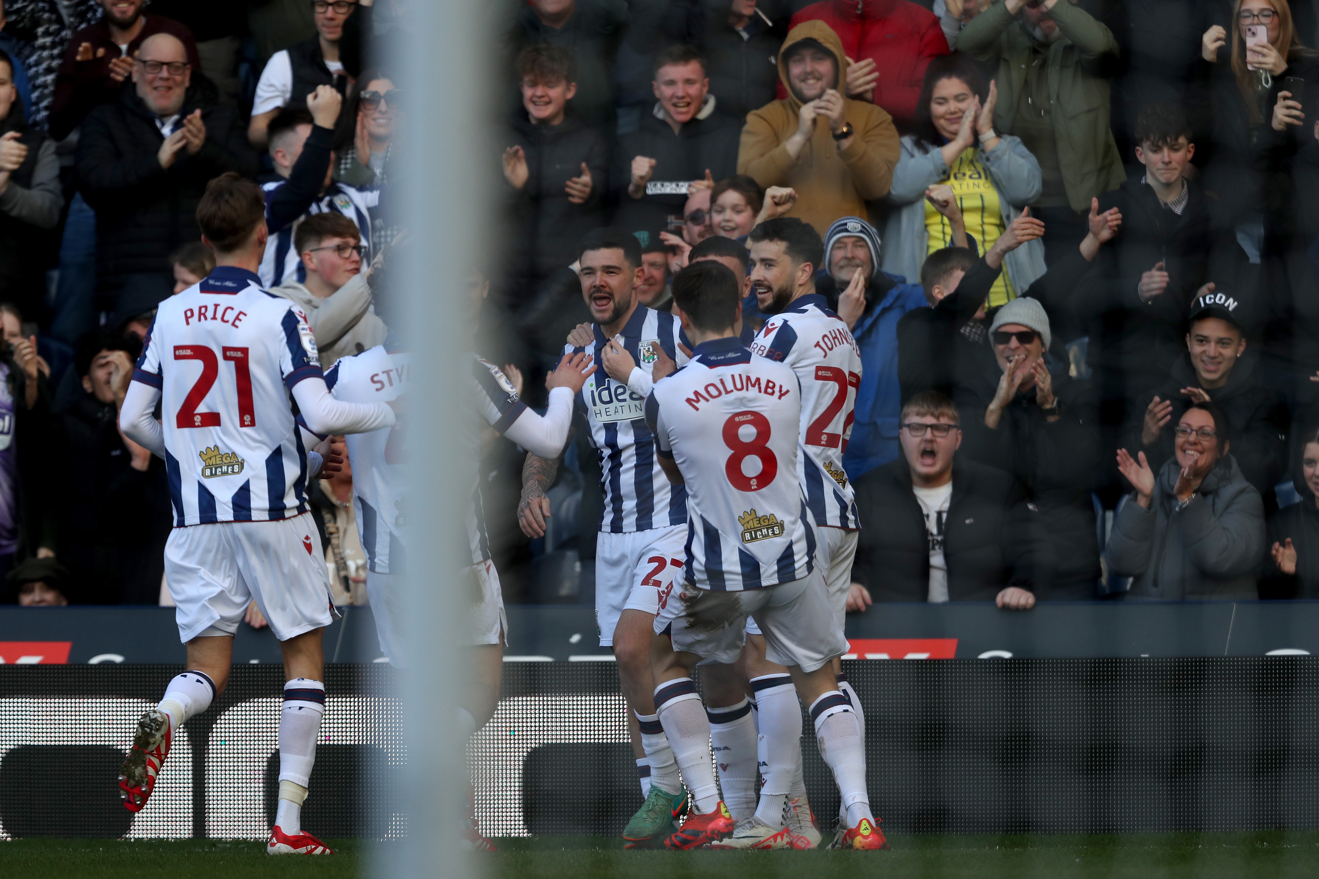 Alex Mowatt celebrates scoring against Oxford at The Hawthorns with team-mates 