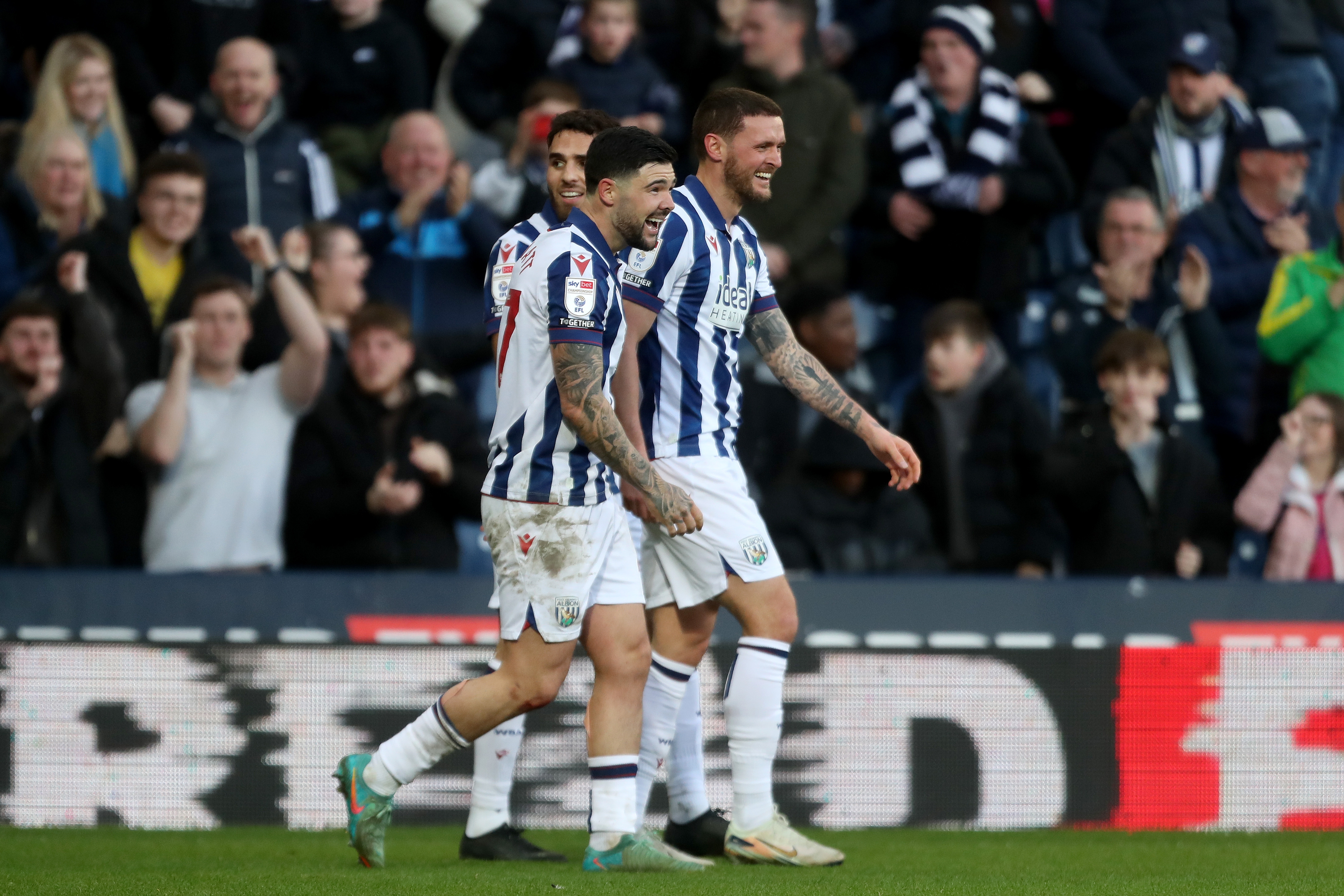 John Swift celebrates scoring against Oxford at The Hawthorns