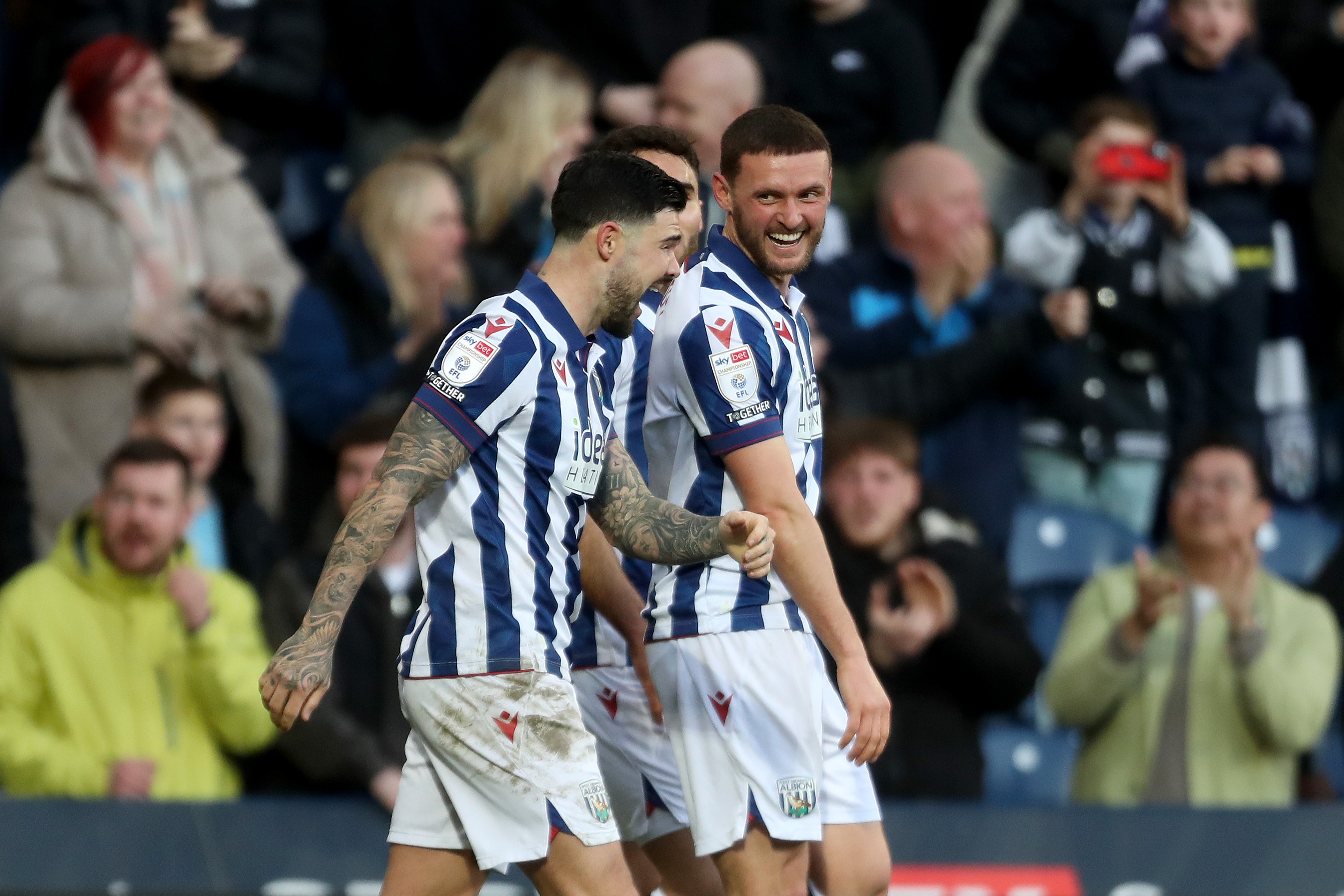 John Swift celebrates scoring against Oxford at The Hawthorns