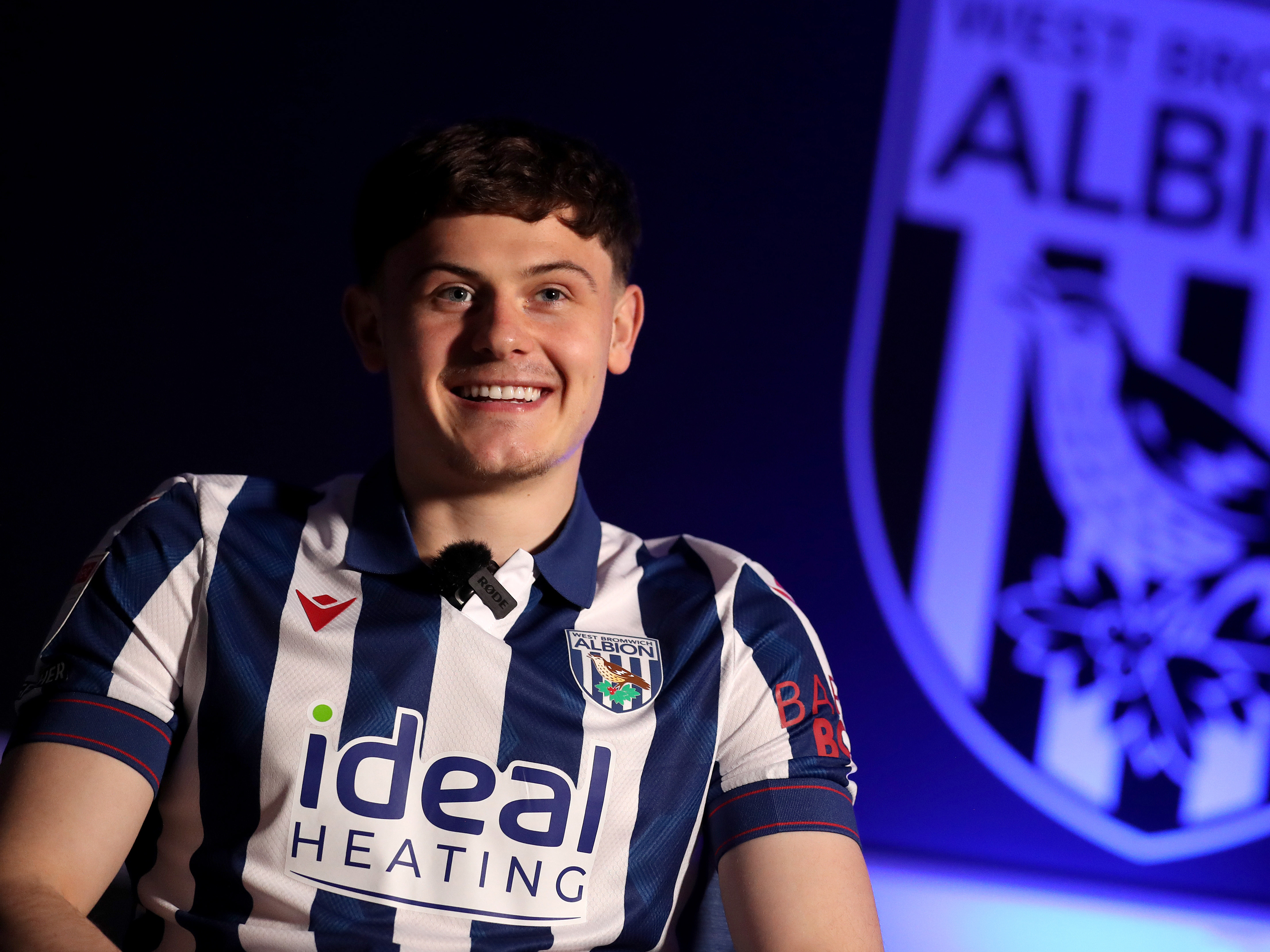 Will Lankshear is interviewed by WBA TV while sat in a home shirt 