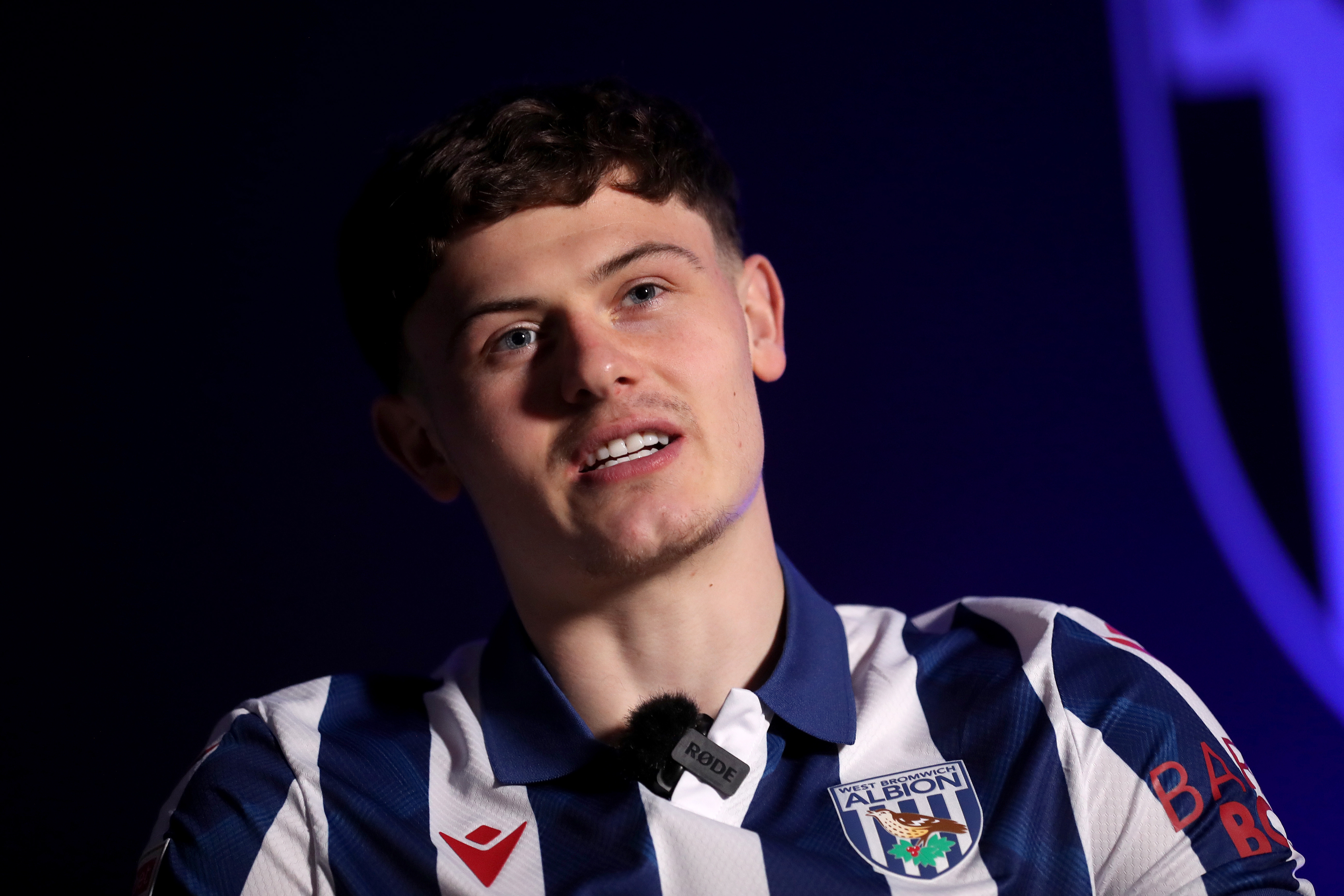 Will Lankshear is interviewed by WBA TV while sat in a home shirt 