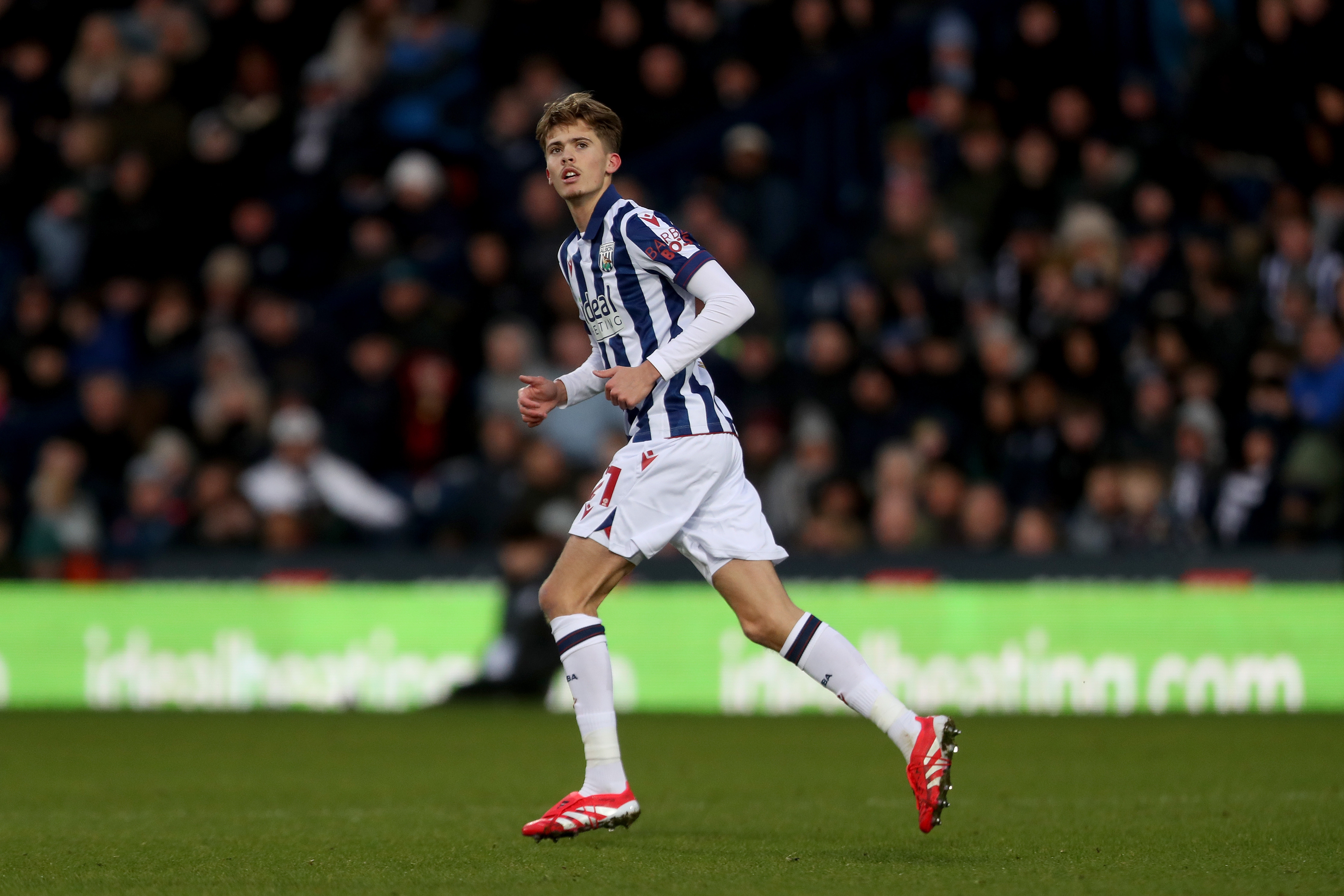 Isaac Price in action for Albion in the home kit