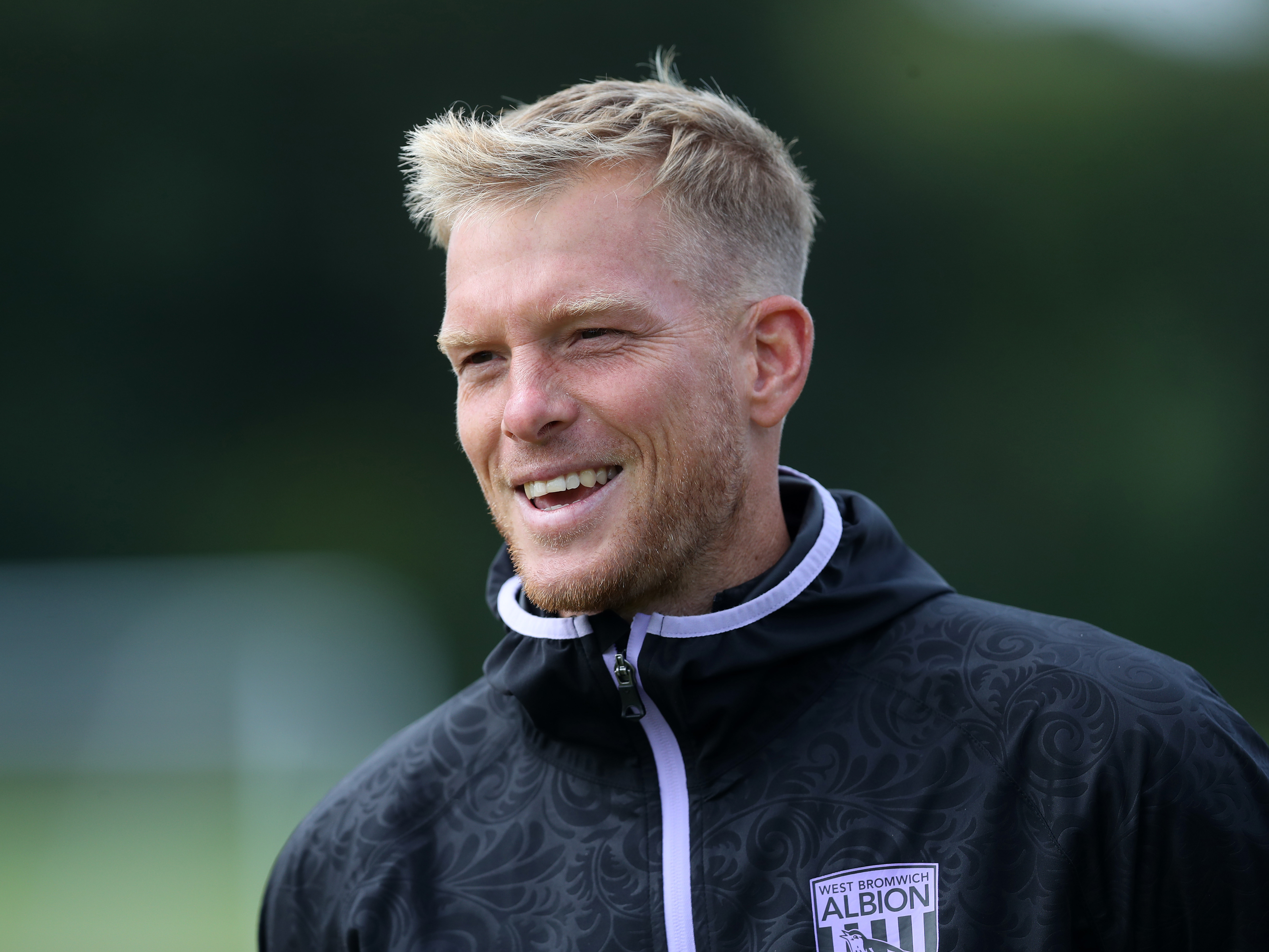 A photo of Albion U18 Lead Coach Leigh Downing in 2024/25 purple and black trainingwear