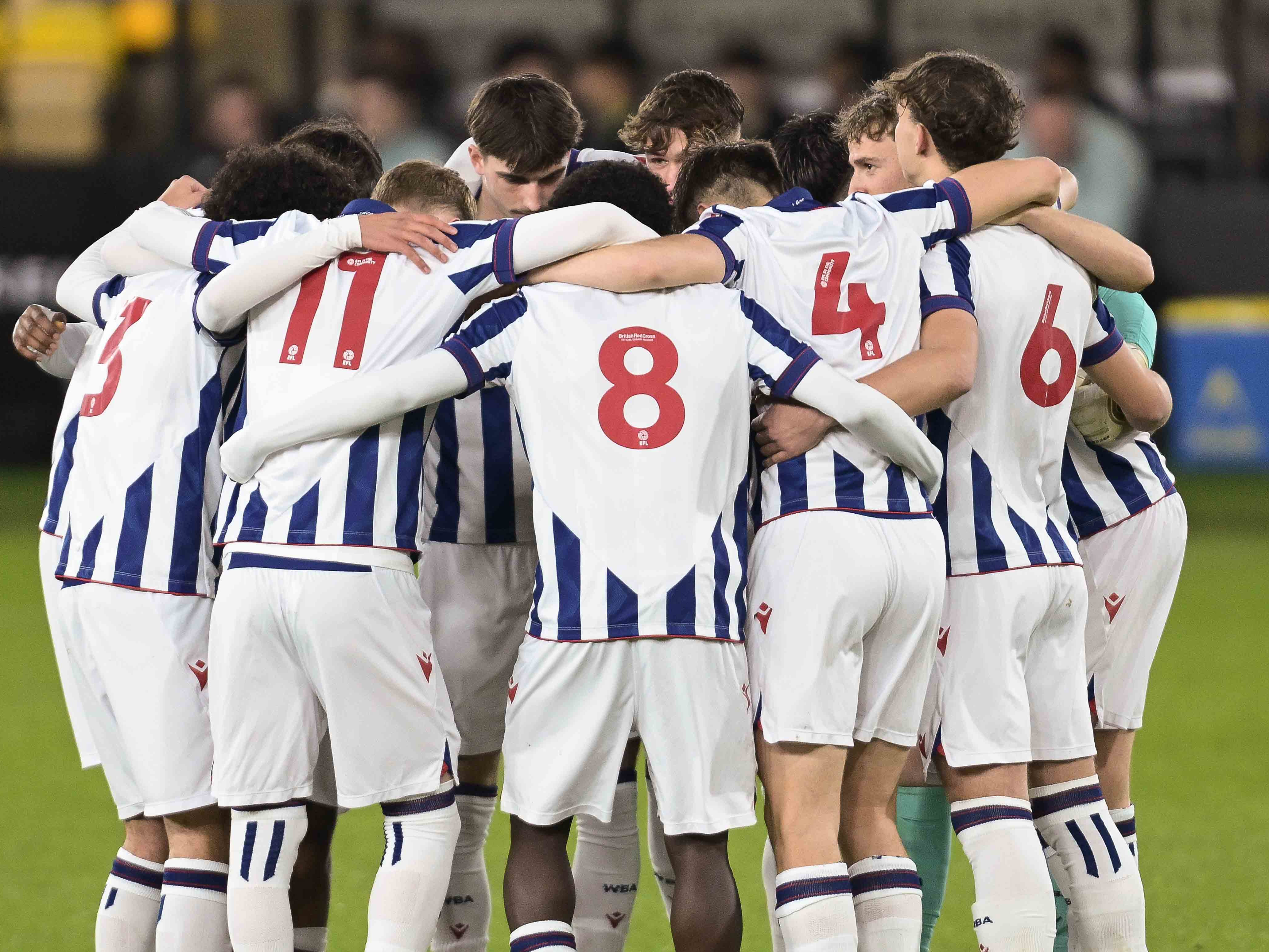 A photo of Albion U18s in a huddle ahead of an FA Youth Cup match