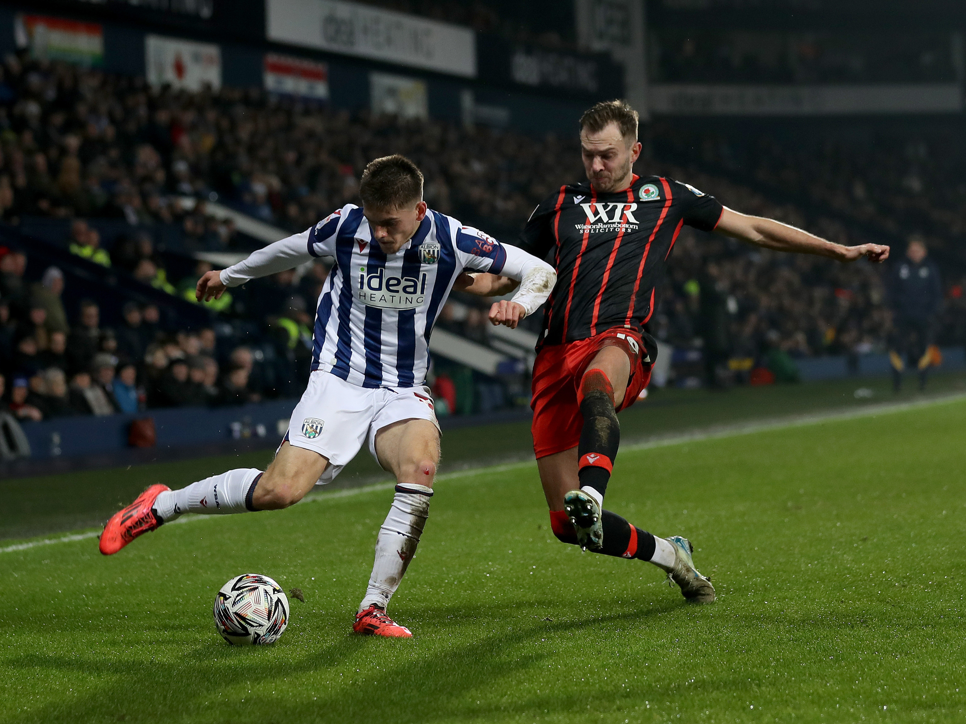 An image of Tom Fellows on the ball against Blackburn