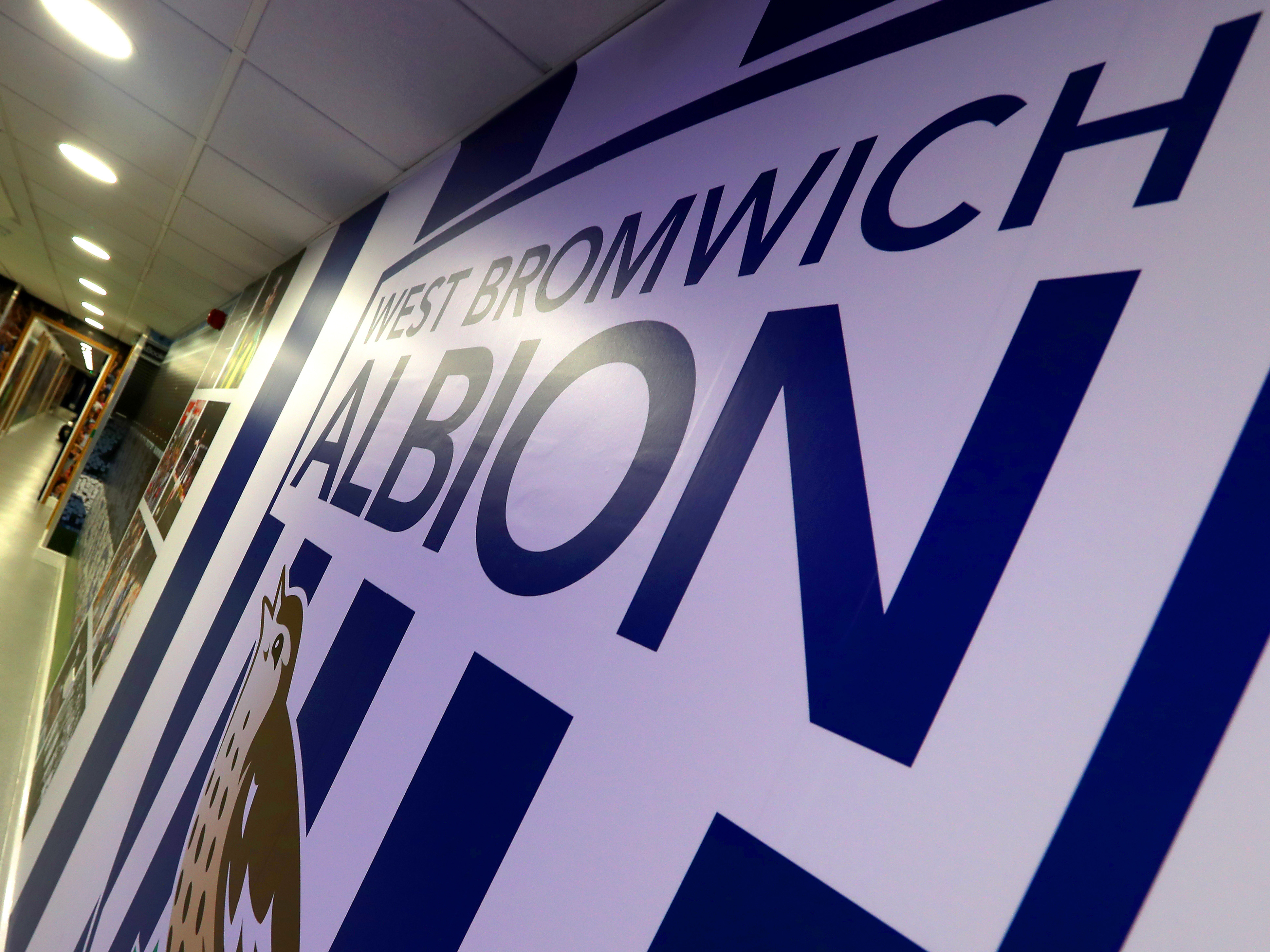 A WBA badge on the walls in the tunnel area at The Hawthorns