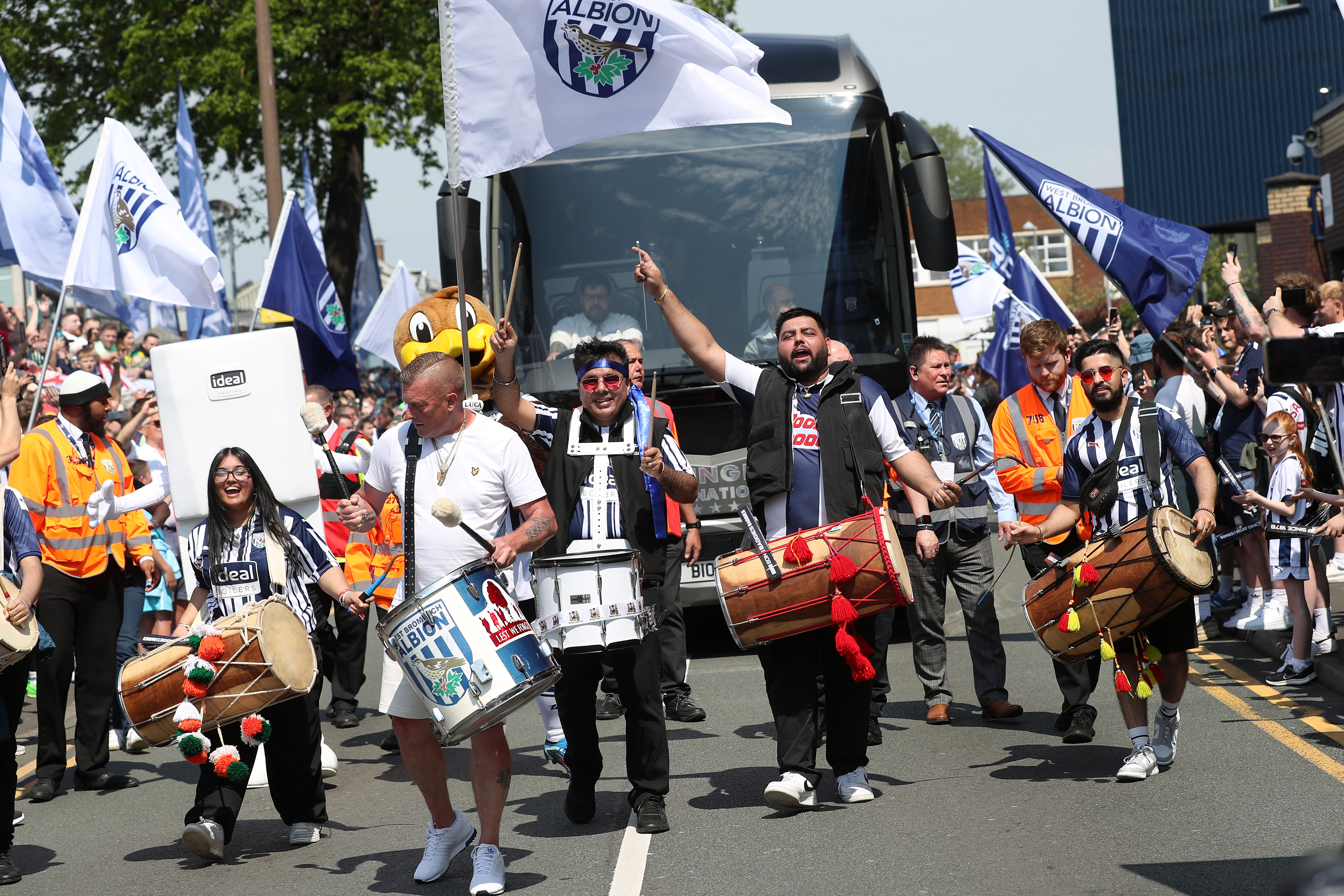 Albion fans welcome the team coach to The Hawthorns before the play-off semi-final against Southampton in May 2024