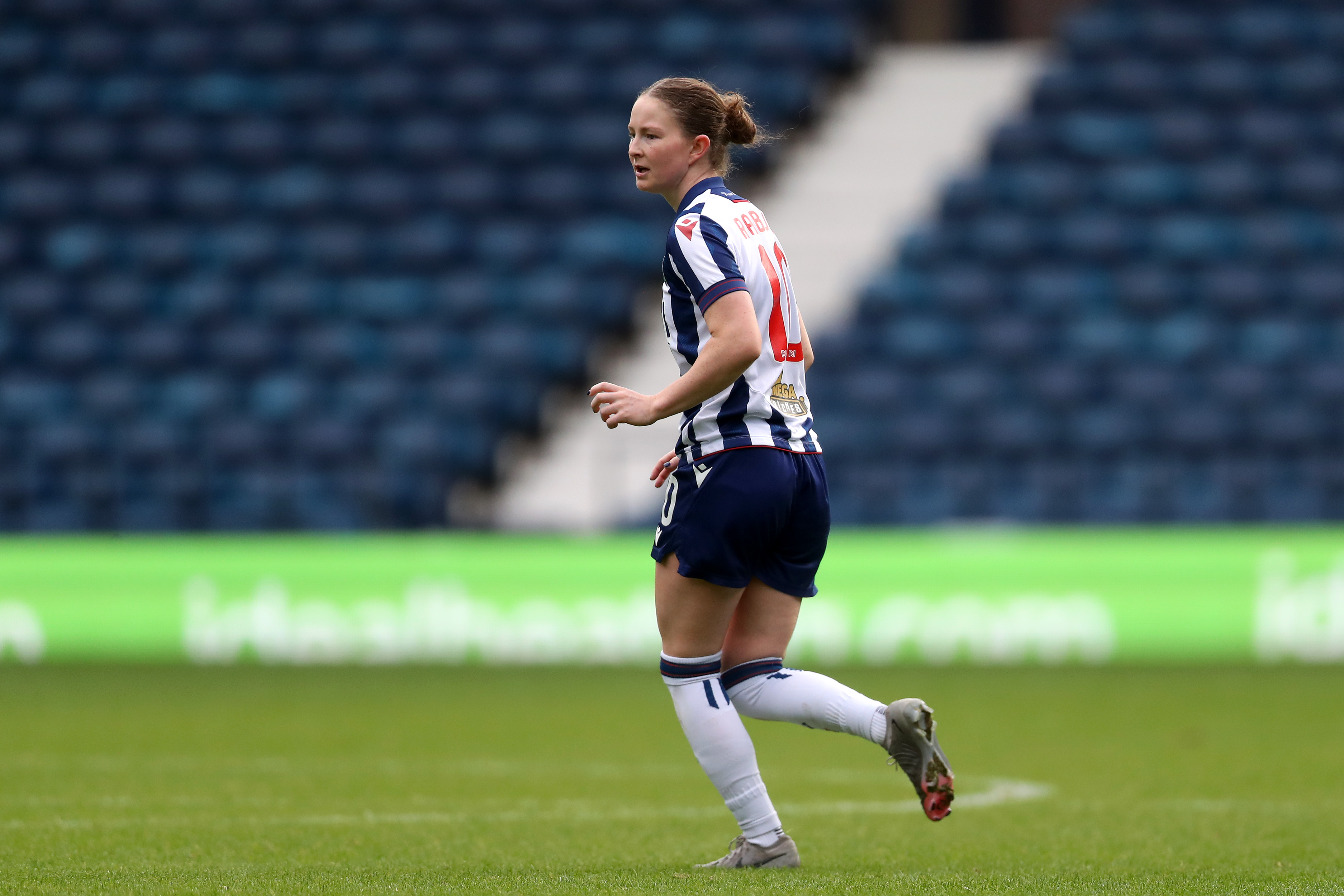 Olivia Rabjohn in action for Albion Women wearing the home kit