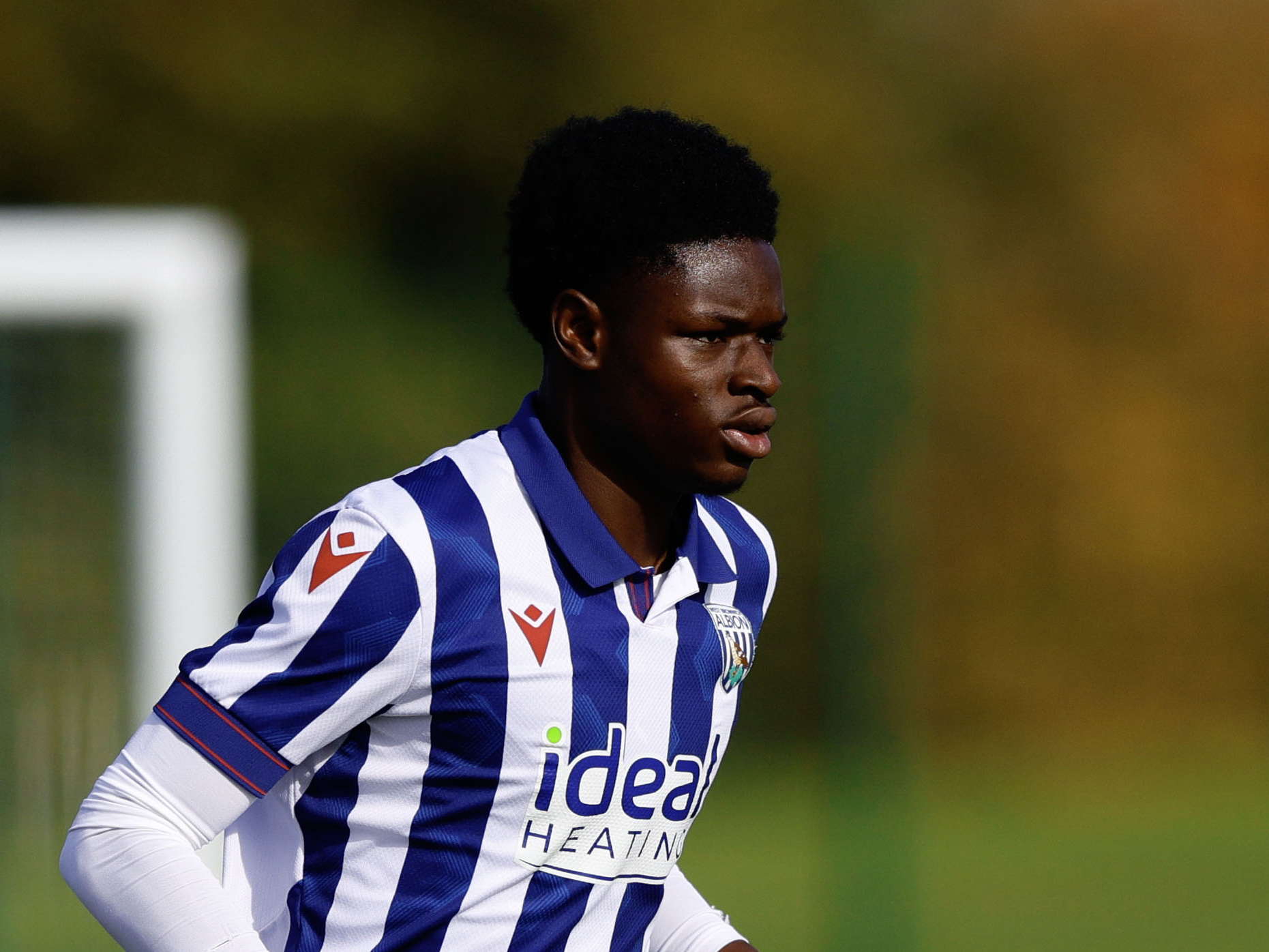 Abdul Abudu in action in the home kit for Albion's U18 side