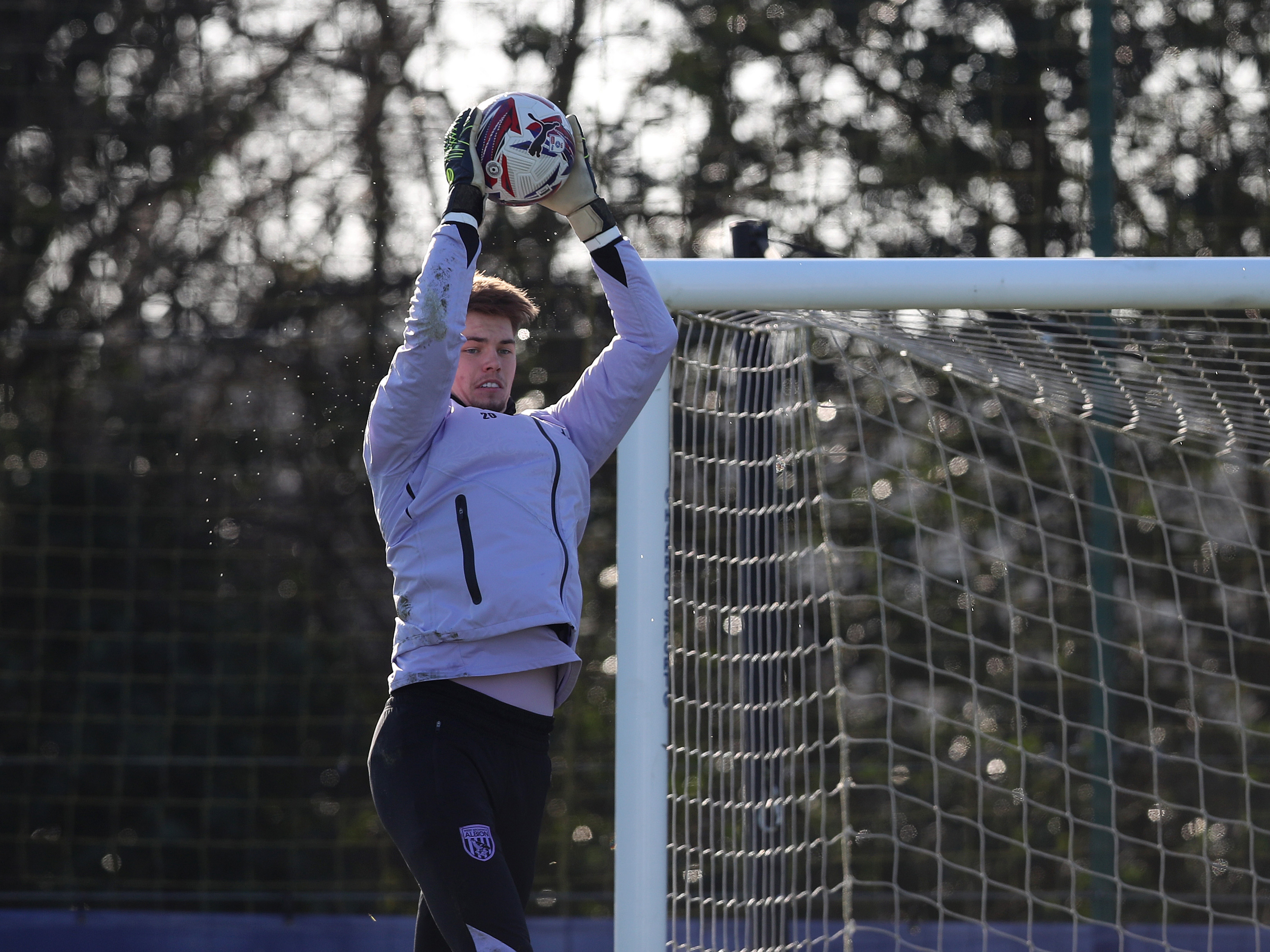 An image of Josh Griffiths catching a ball in training