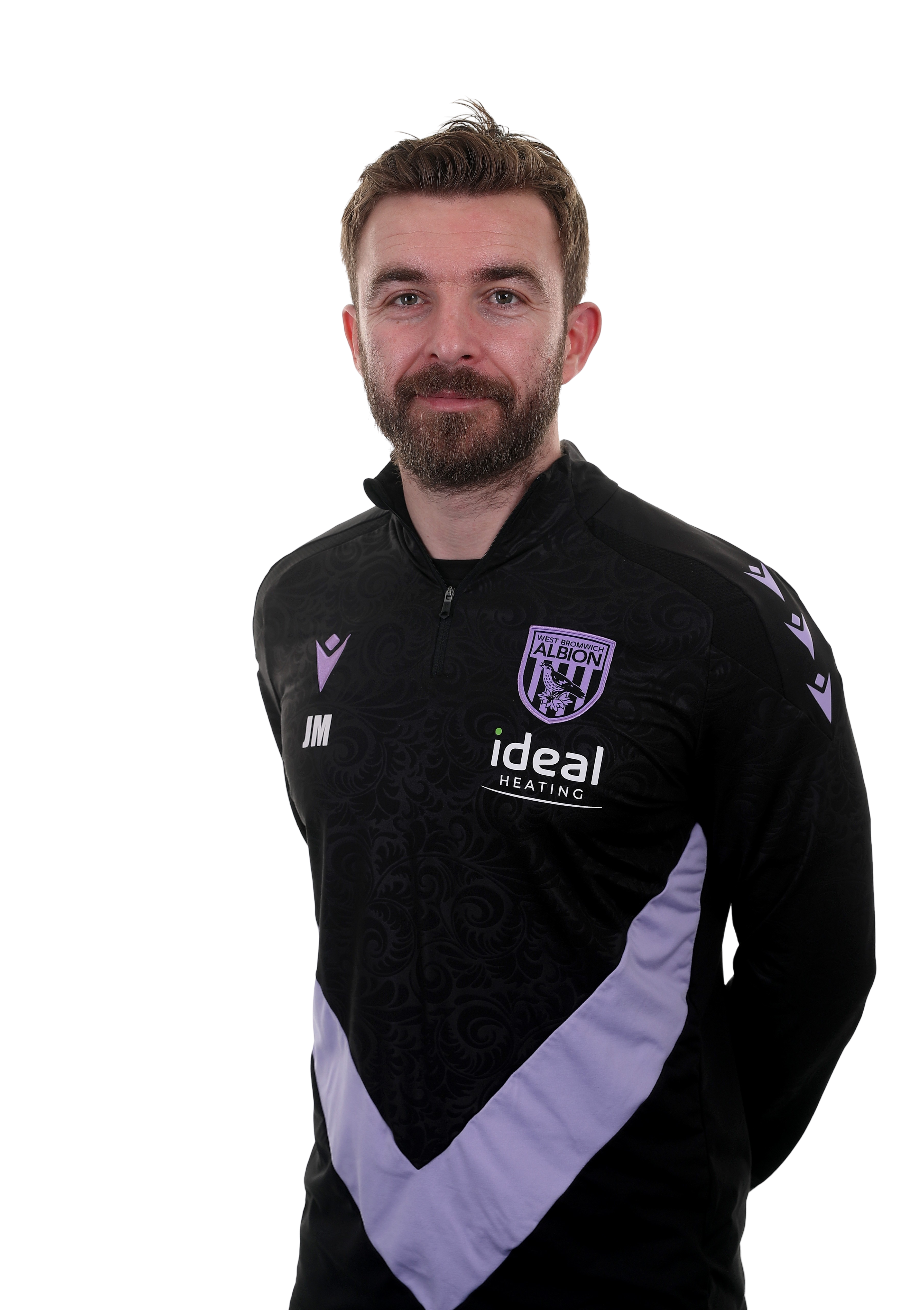 A photo of James Morrison in the 2024/25 purple and black trainingwear