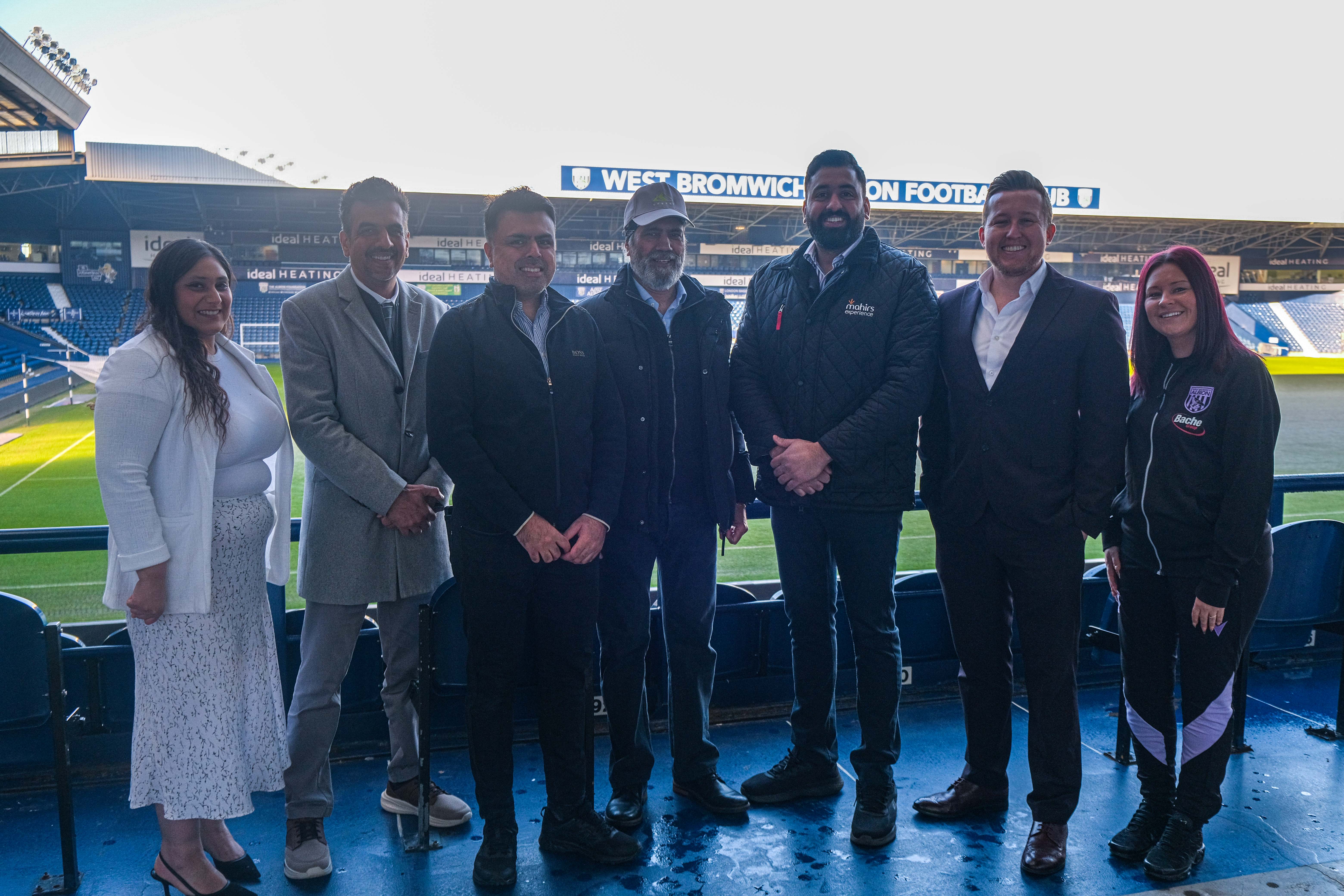 Members of staff from Mahirs Experience and The Albion Foundation pose for a photo.