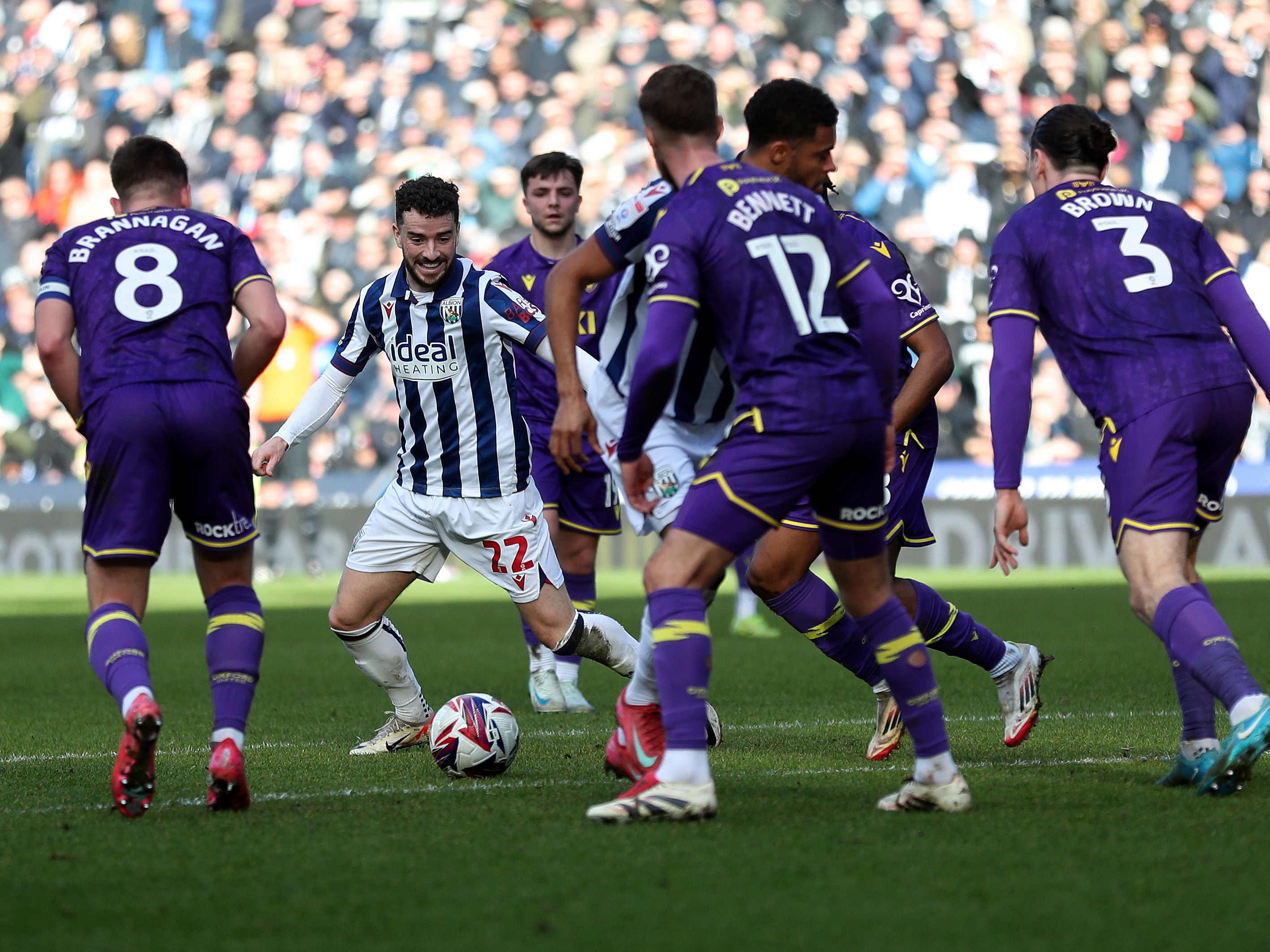 An image of Mikey Johnston surrounded by Oxford players