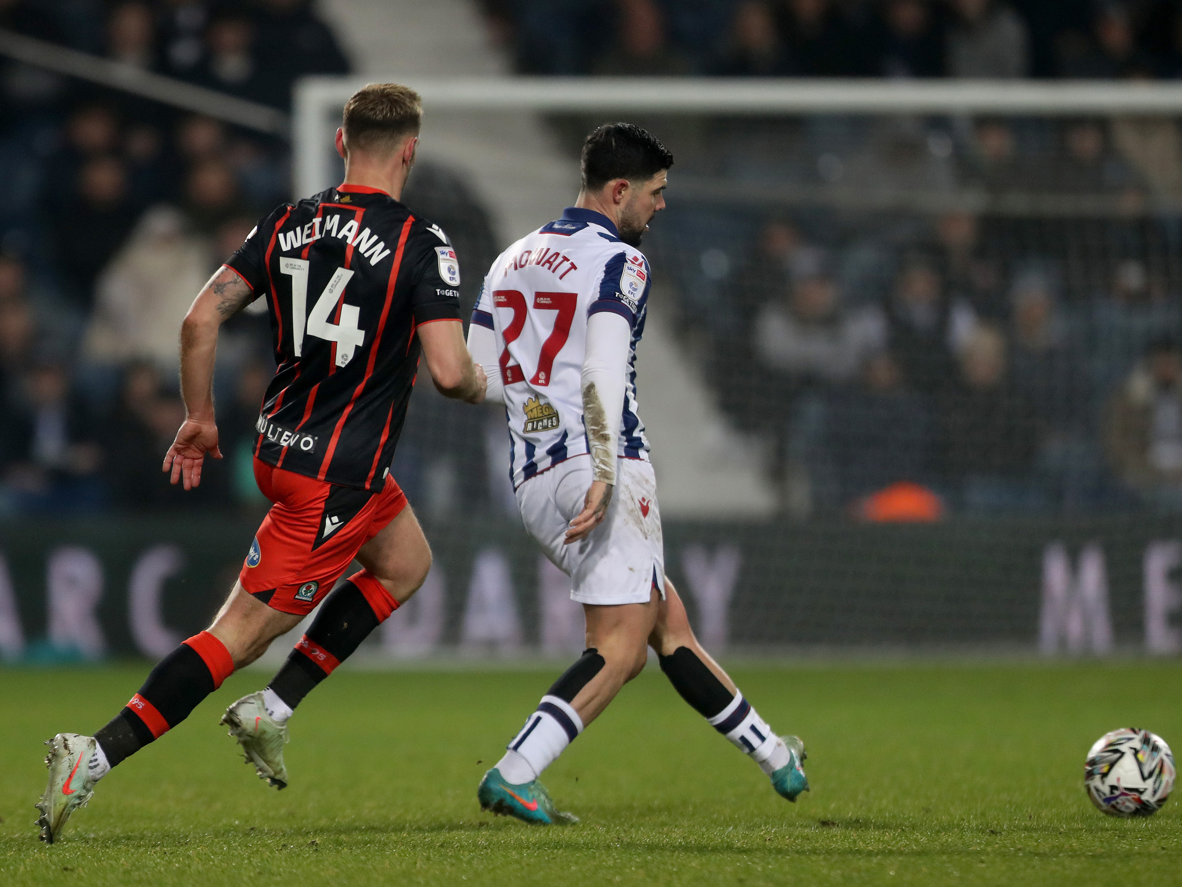 An image of Alex Mowatt on the ball against Blackburn