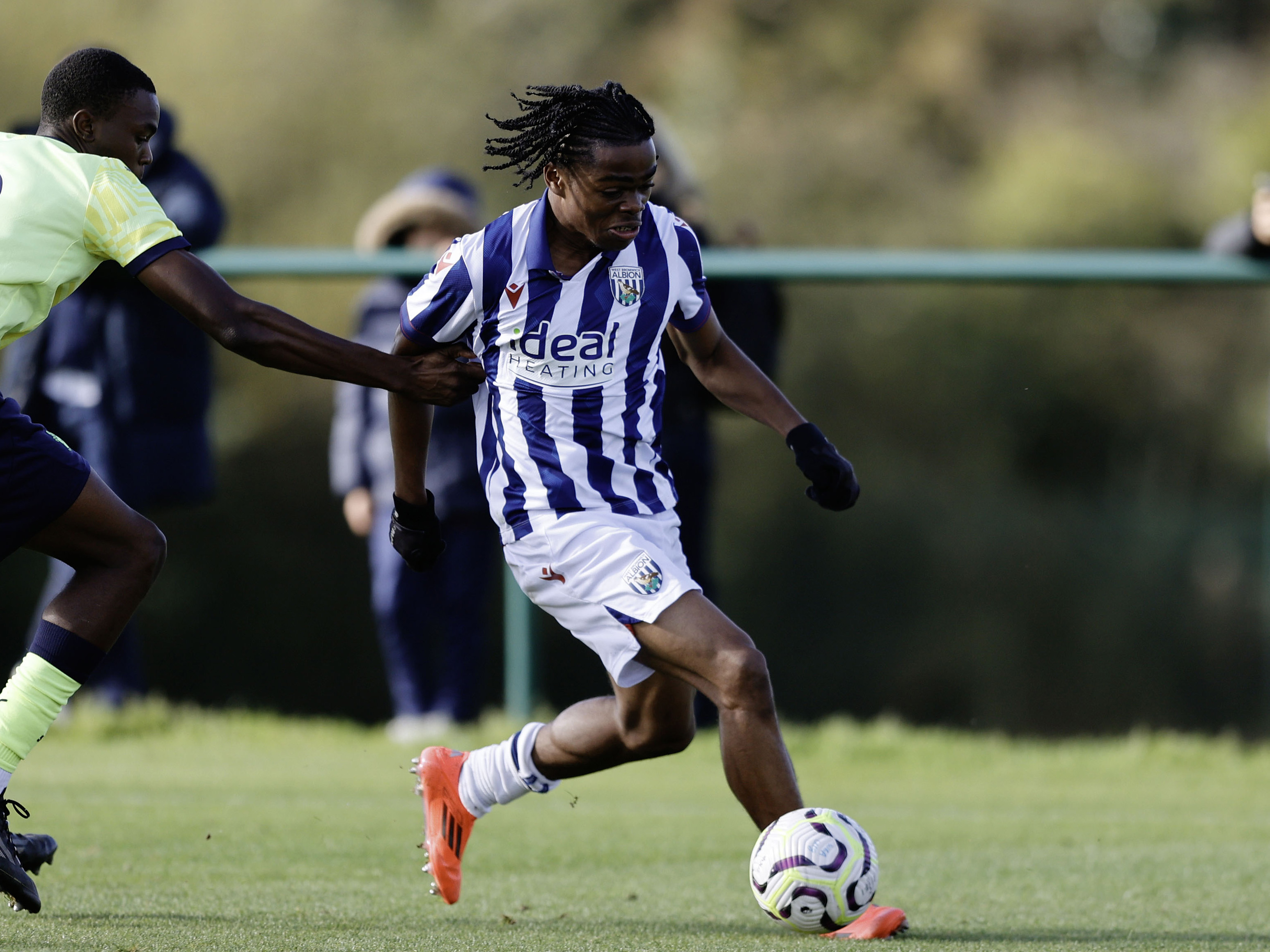 A photo of Albion U18 forward Divine Onyemachi in the 2024/25 home kit