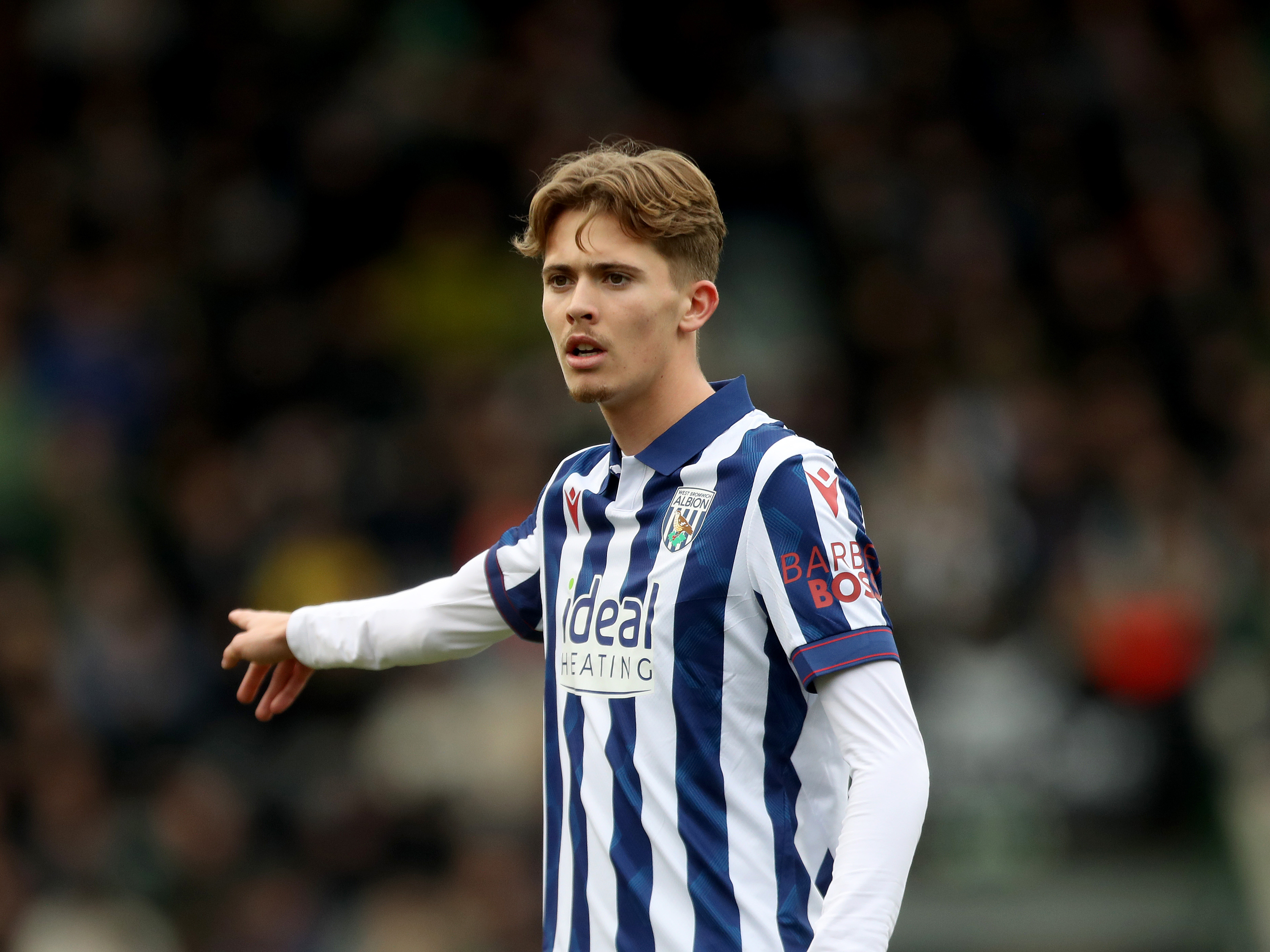 Isaac Price in the home kit pointing during a game