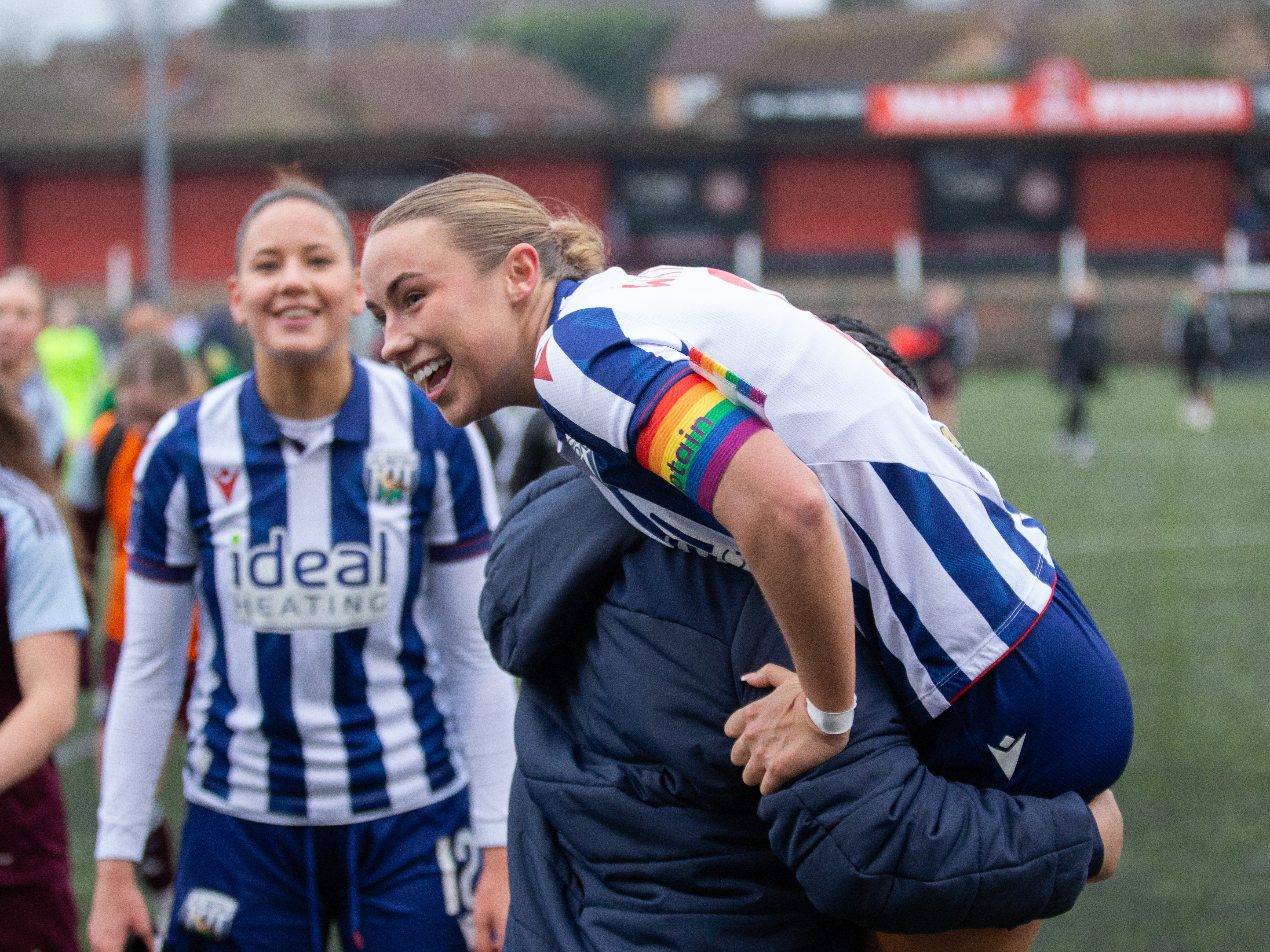 An image of Seren Watkins celebrating Albion Women's win against Aston Villa