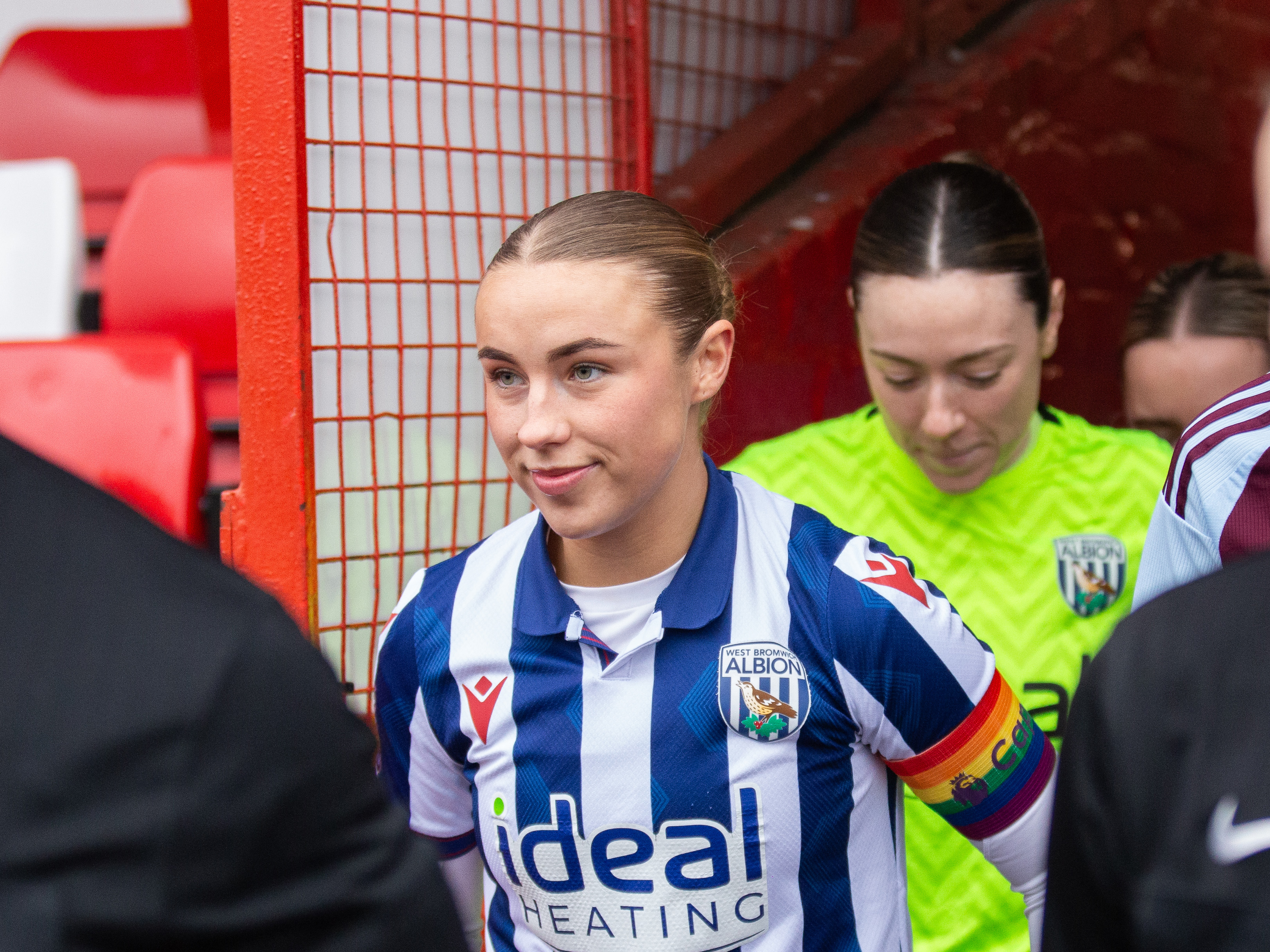 An image of captain for the day Seren Watkins leading the team out