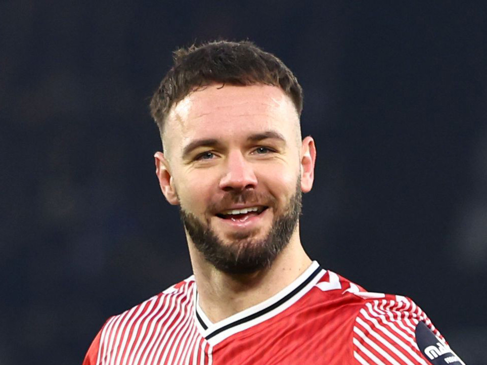 A close up of Adam Armstrong as he smiles 